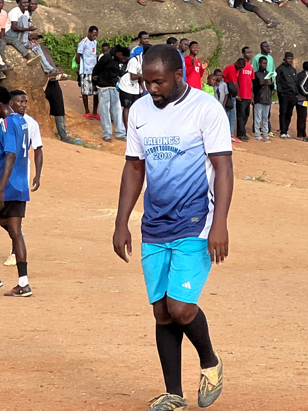 Pickup football on a red-dirt pitch in Jos, Nigeria