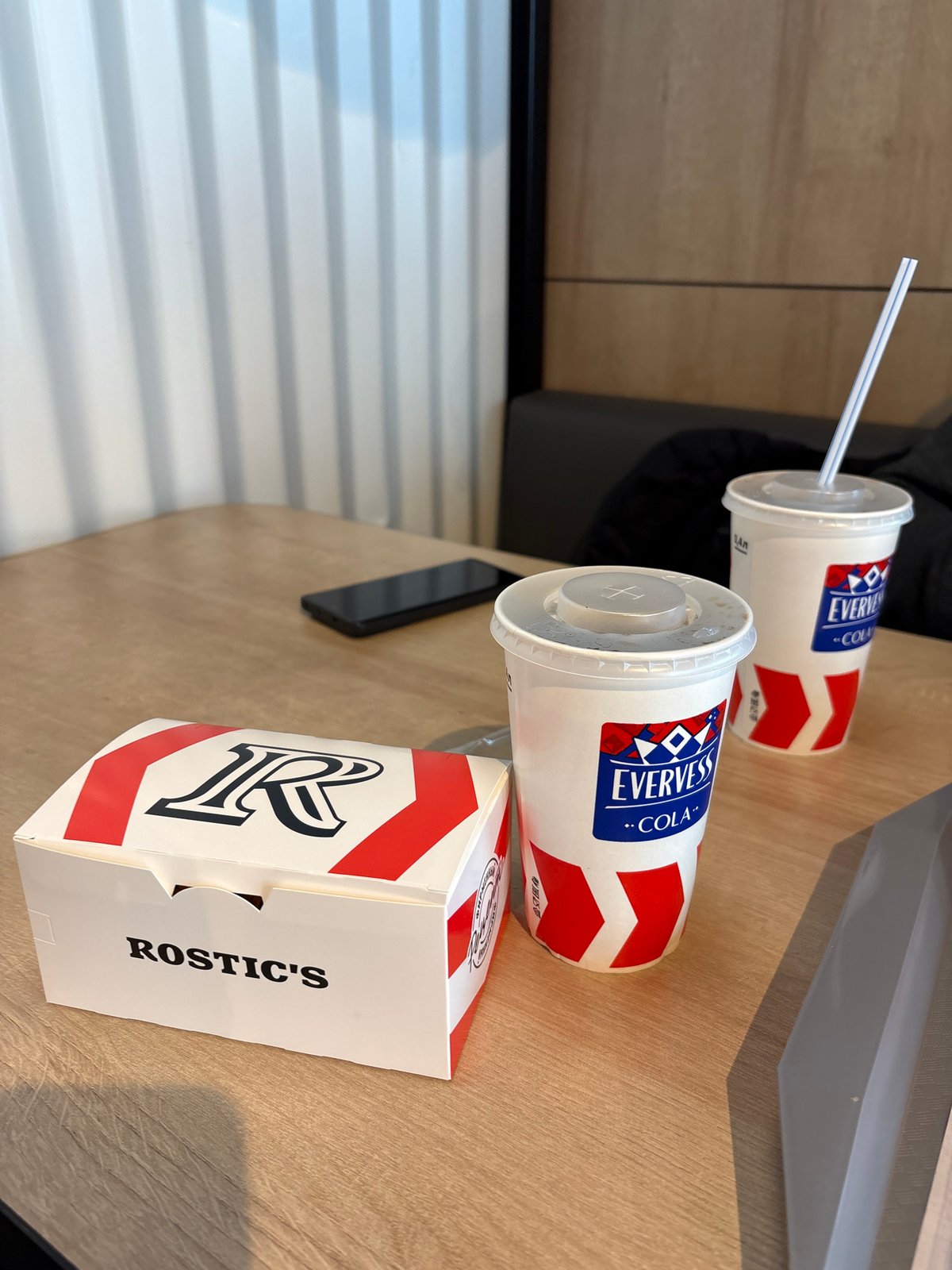 Morning scenes documented in Krasnoyarsk include fast-food meal, woman
