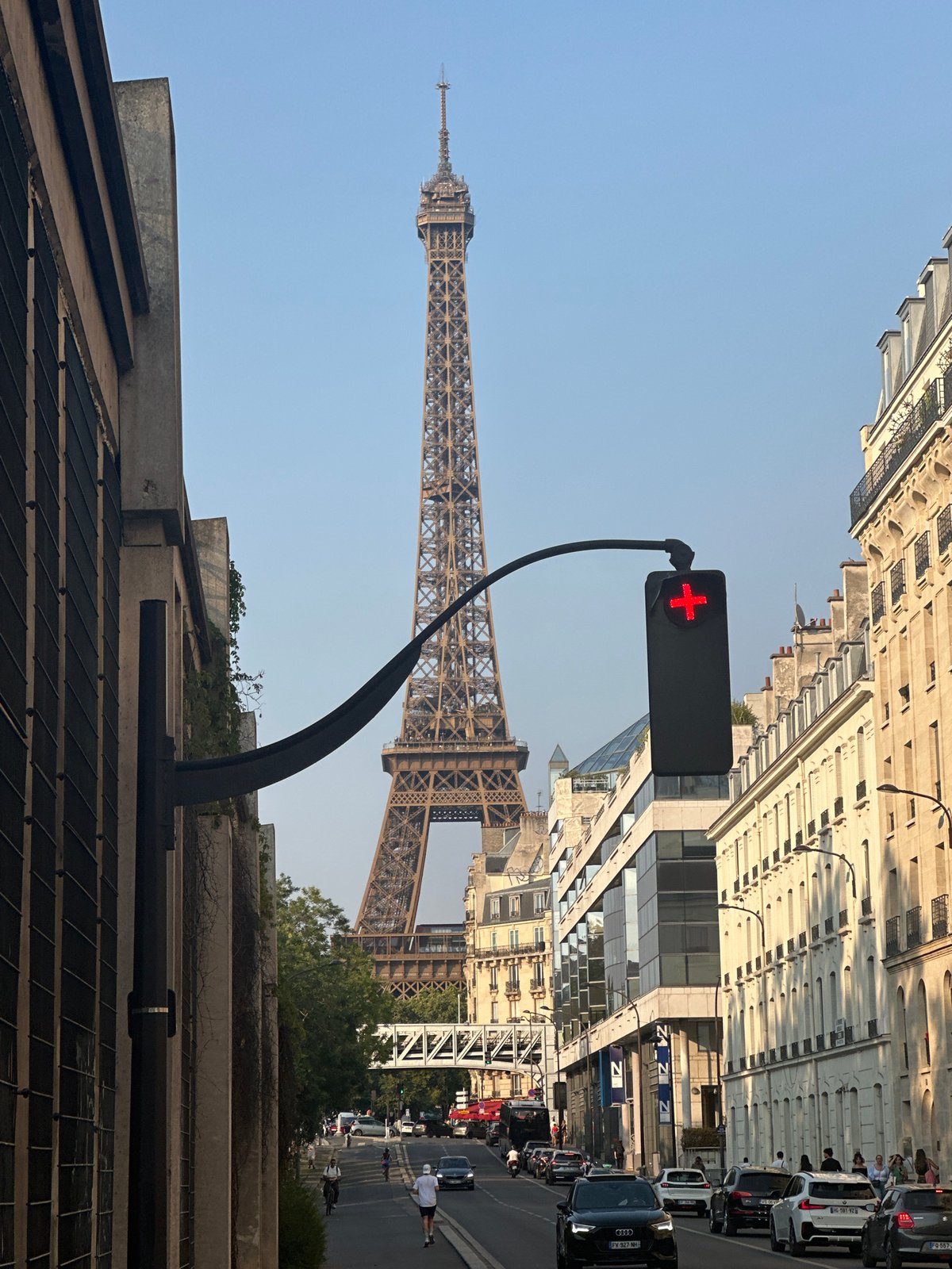 Street-level views near the Eiffel Tower on a sunny Paris afternoon