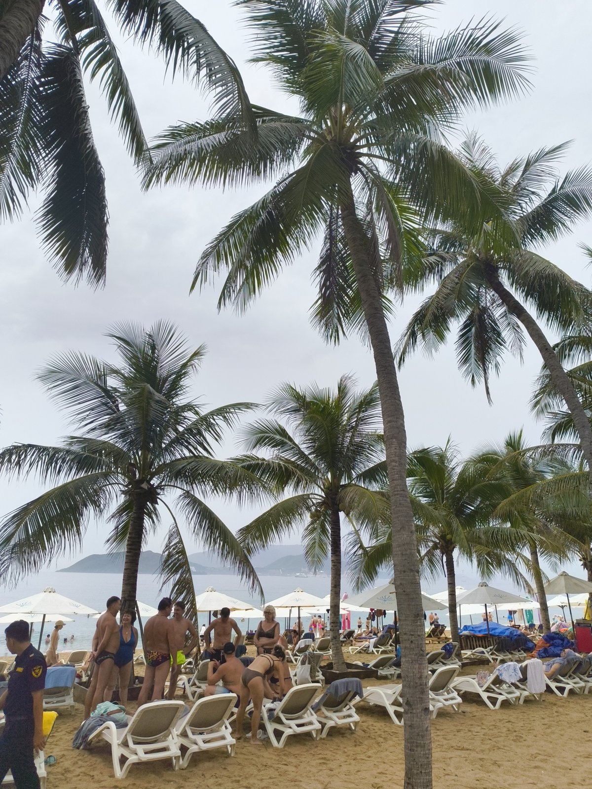 Nha Trang beach on a cloudy morning, busy as usual