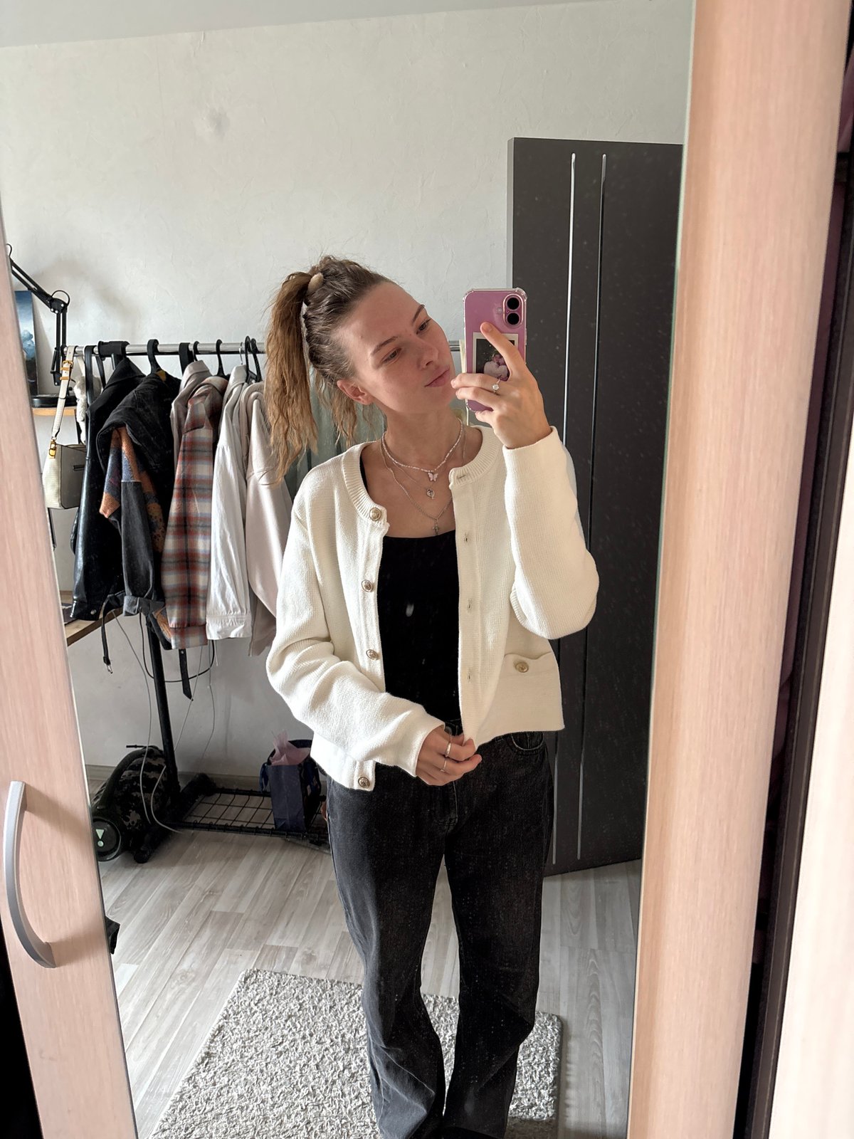 Mirror selfie session trying out hairstyles in Perm apartment
