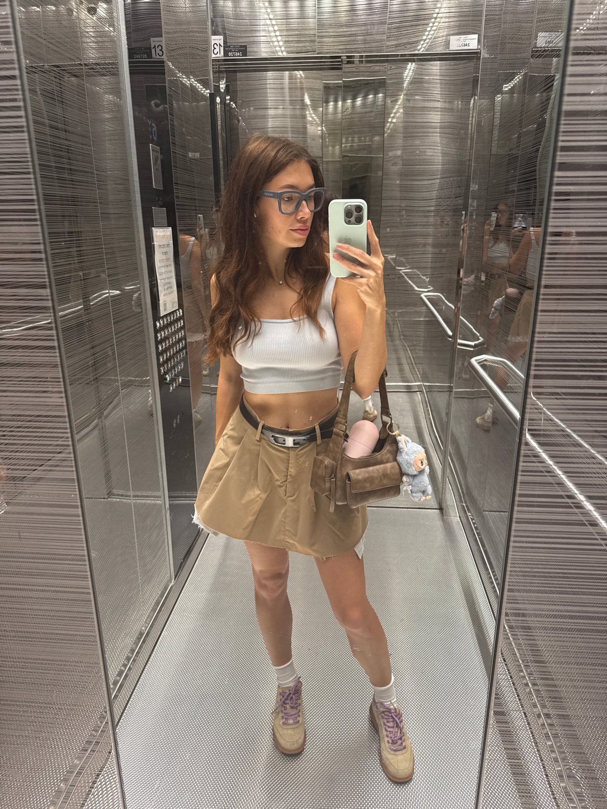 Woman Takes Elevator Selfie in Mirror