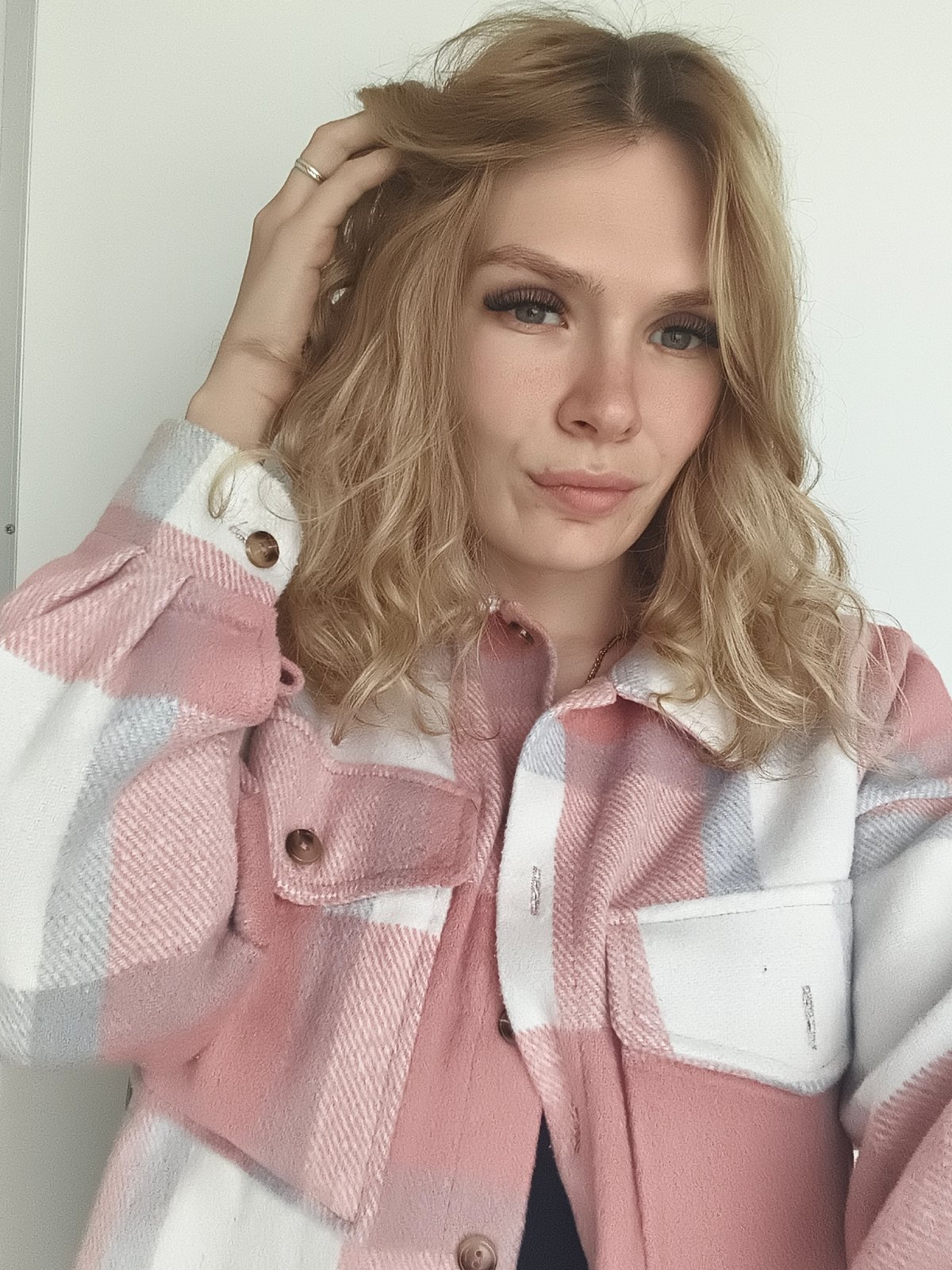 Young woman takes morning selfie in Izhevsk home
