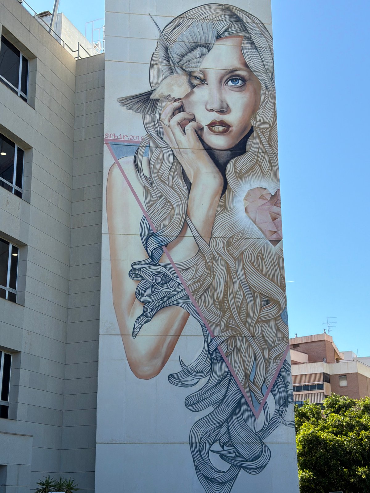Witness documents urban mural and pyramid building architecture