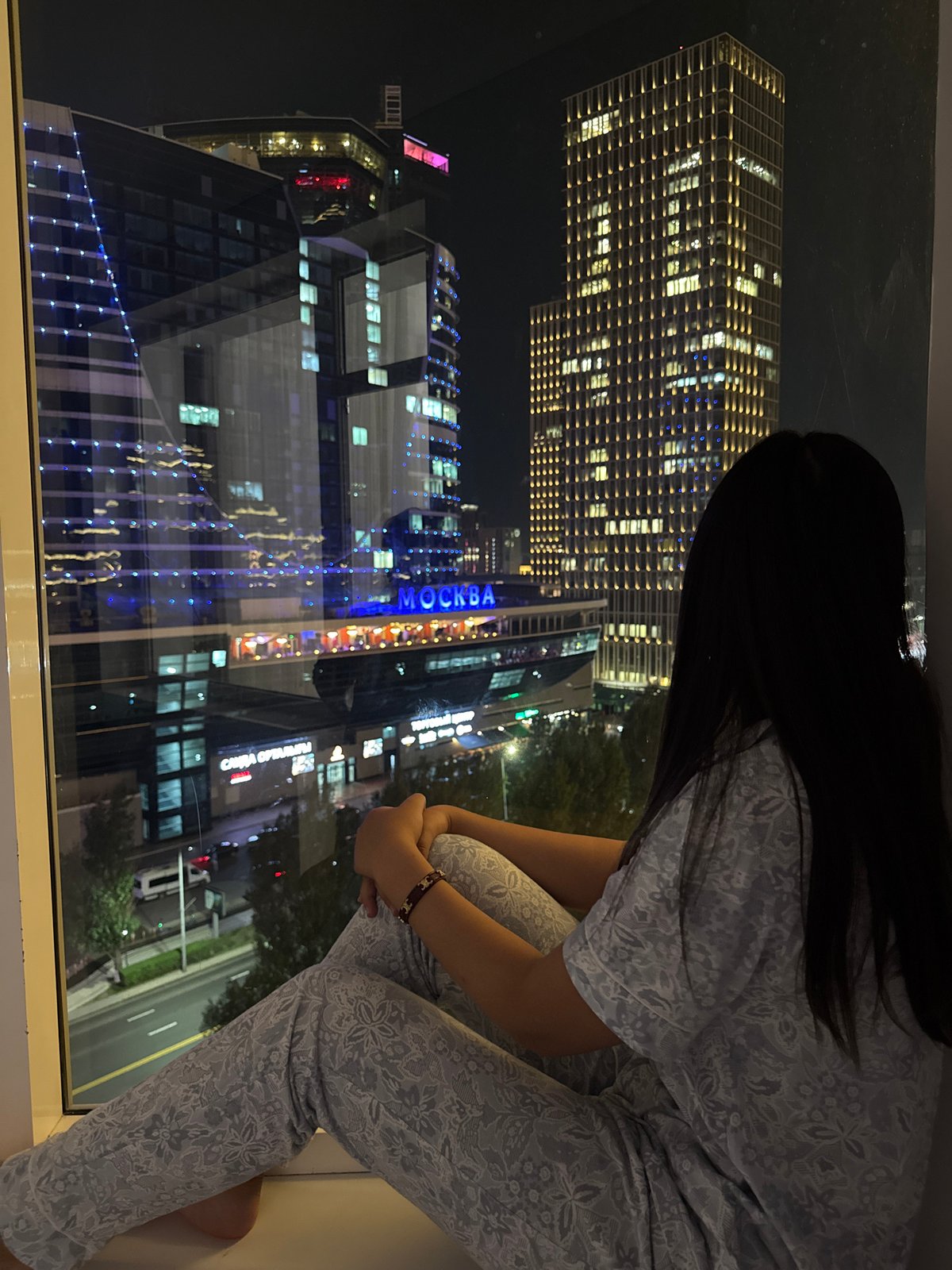 Night in Astana: city skyline views from a high-rise window