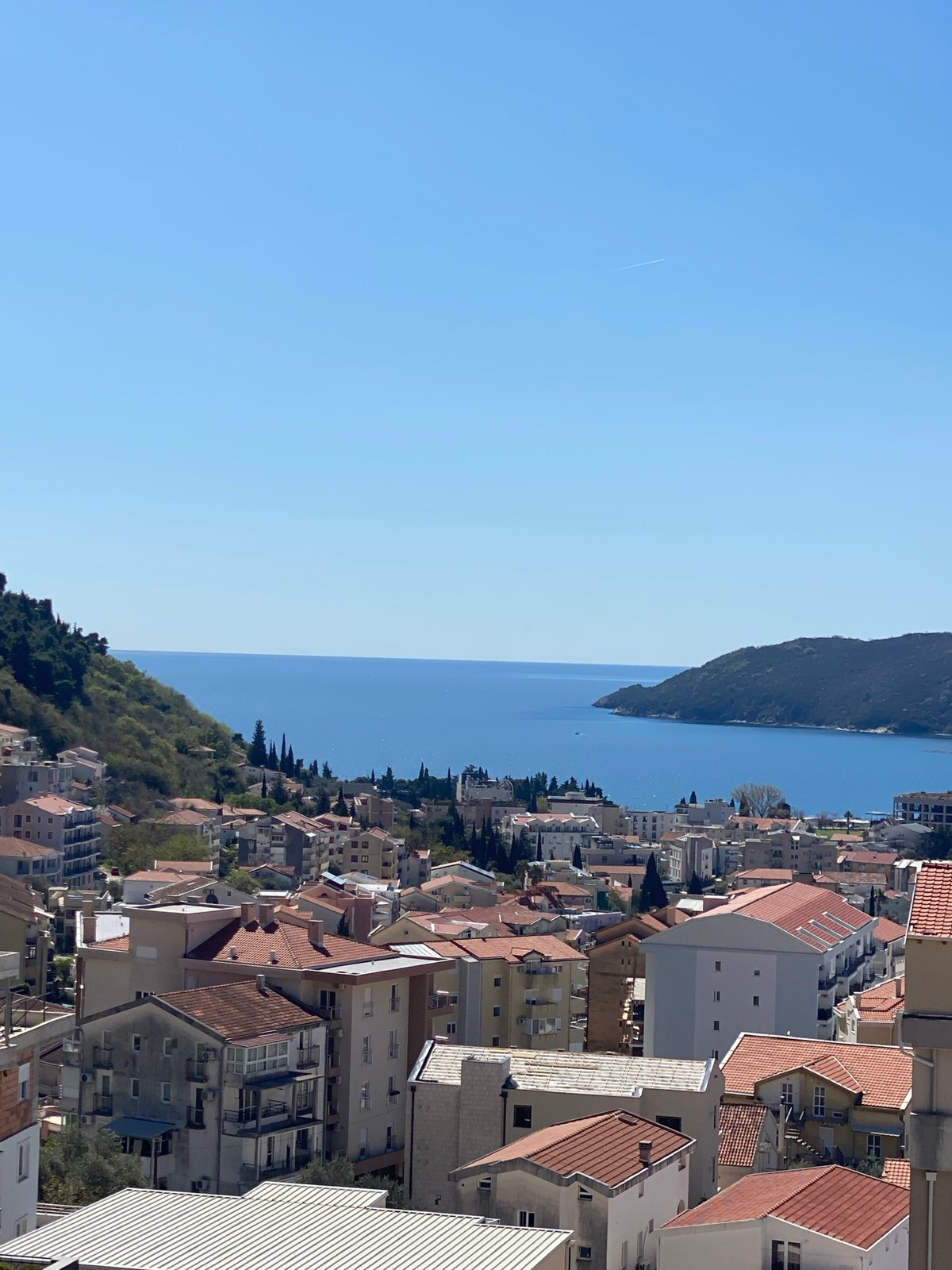Aerial views document Budva's coastal cityscape from above