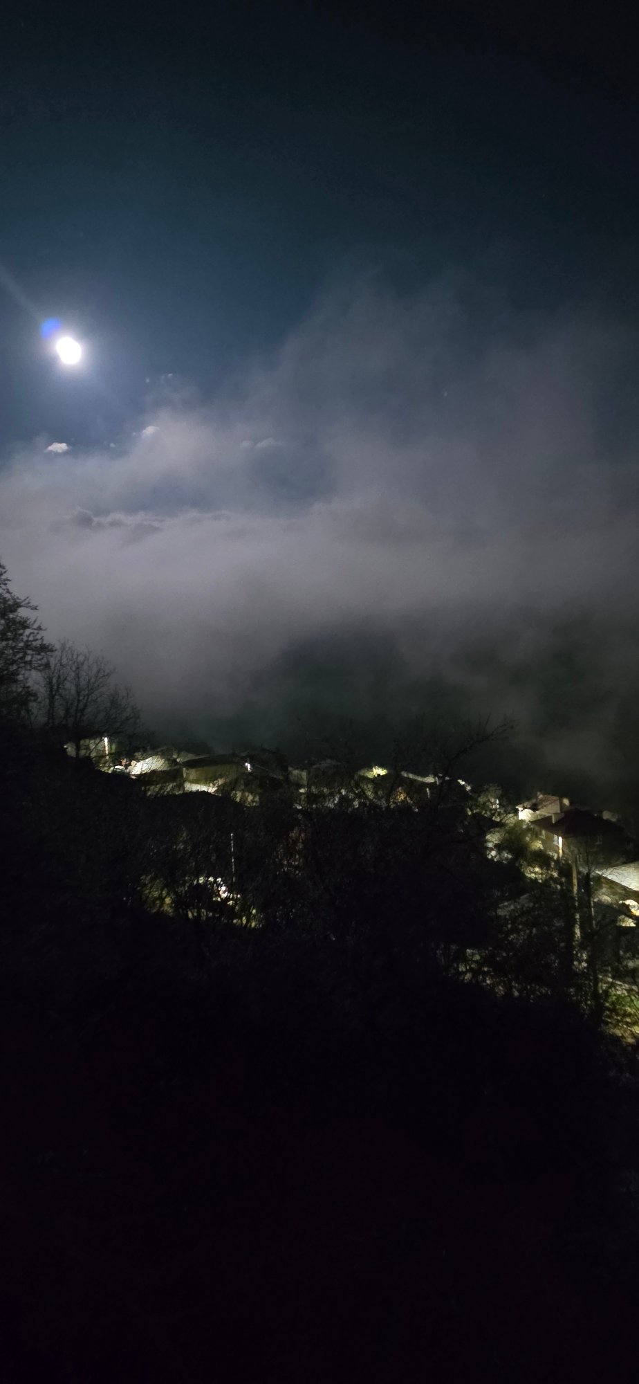 Bright moon observed through clouds in Breze, Bulgaria