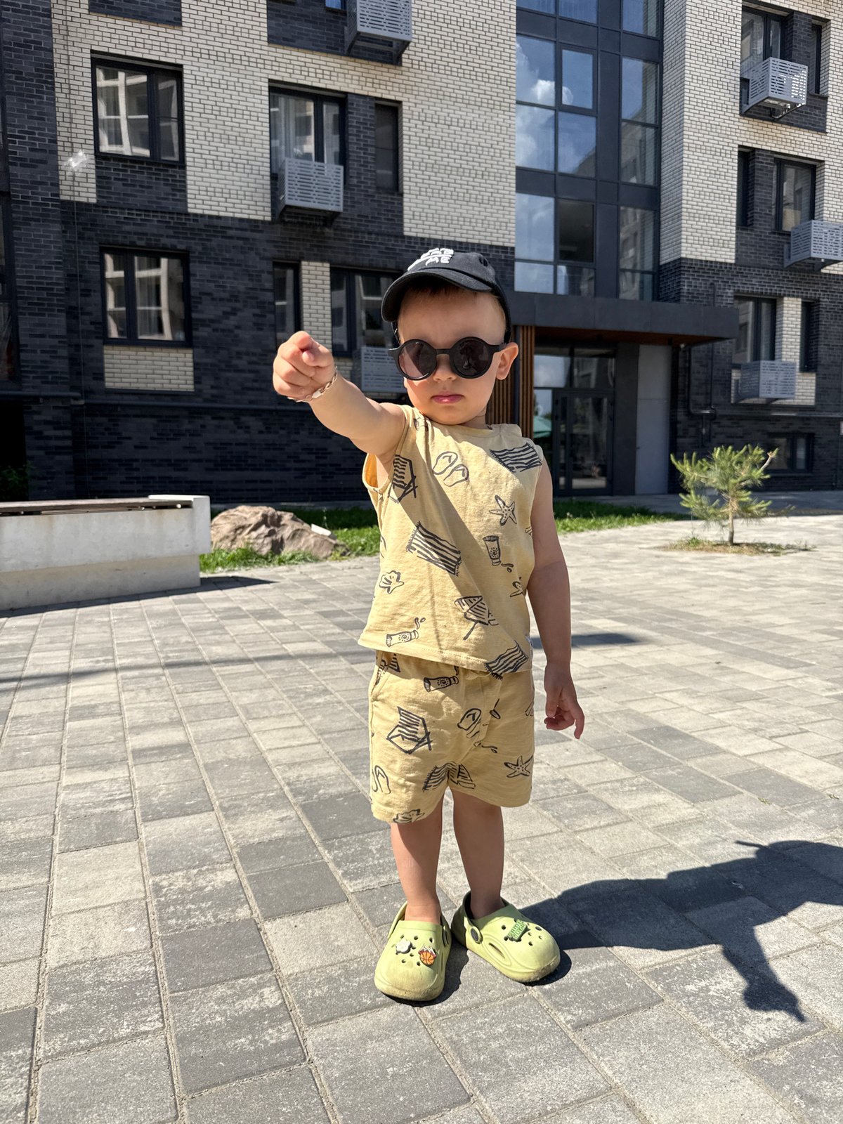 Family morning playtime captured in Rusanovo residential courtyard