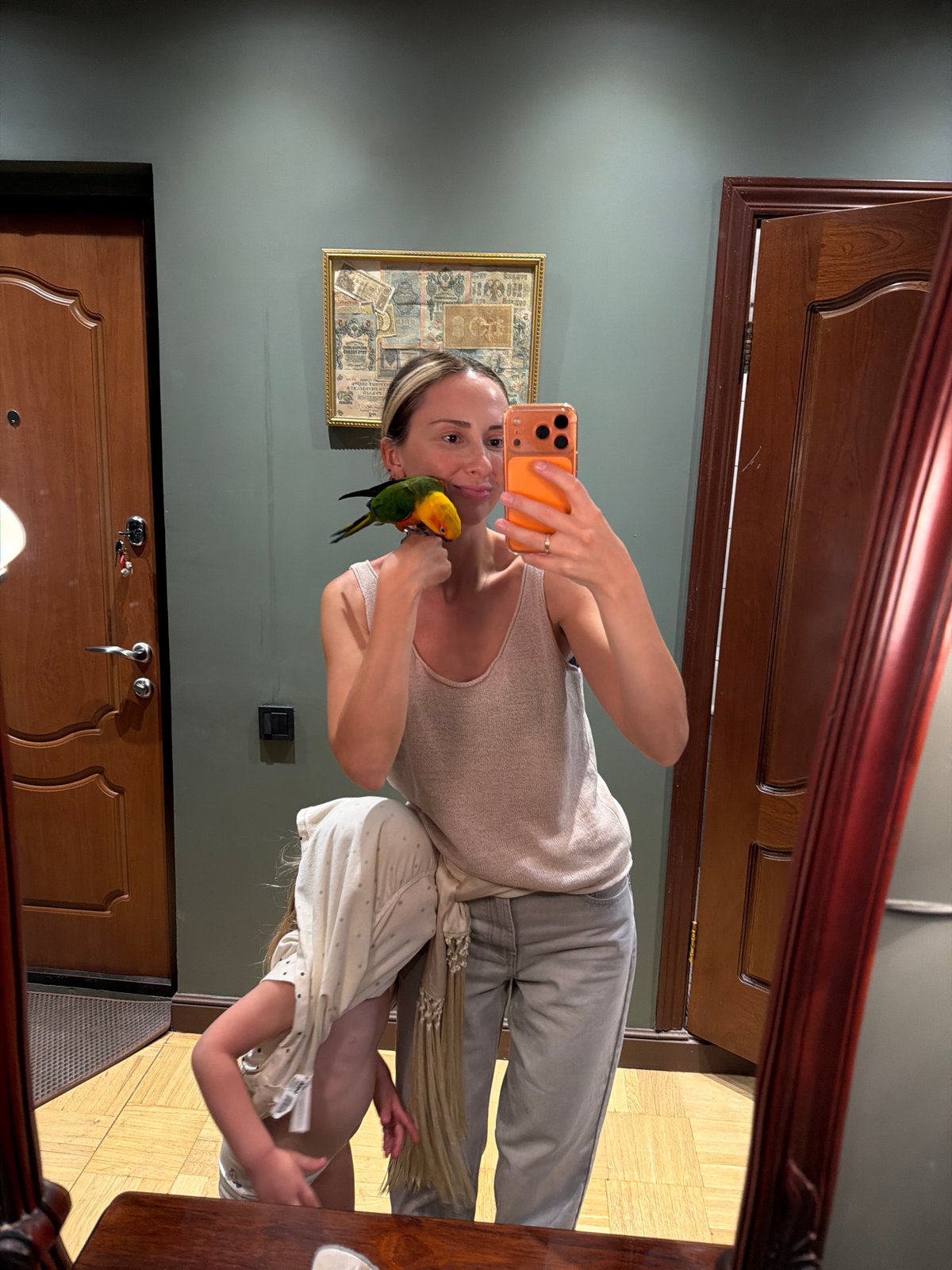 Woman Takes Mirror Selfie With Orange Phone