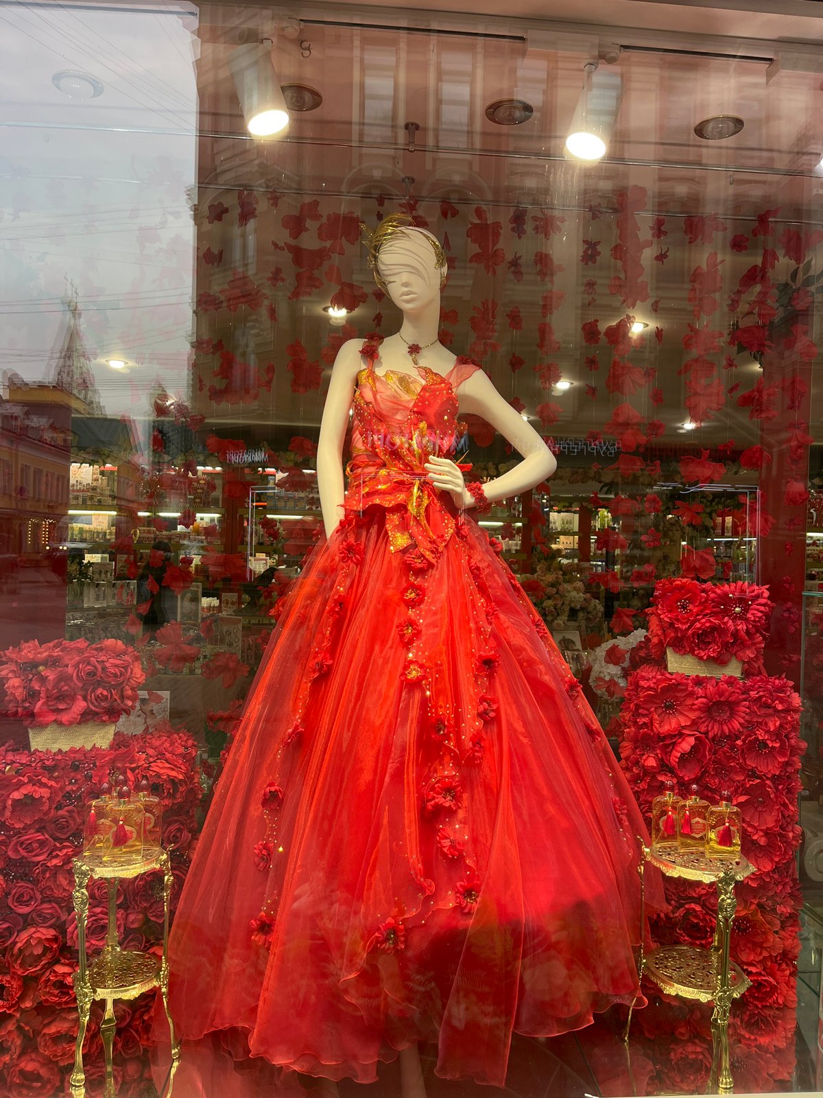 Moscow scenes: bronze statue, red dress window display observed