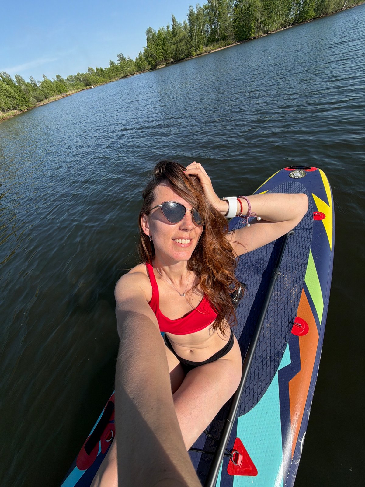 Woman enjoys early morning paddleboarding session near Birobidzhan