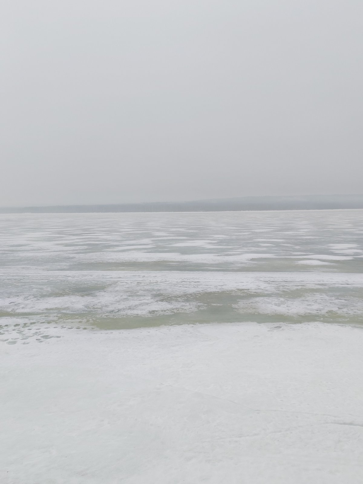 Spring scenes captured in Chaikovsky: frozen river, outdoor chess table