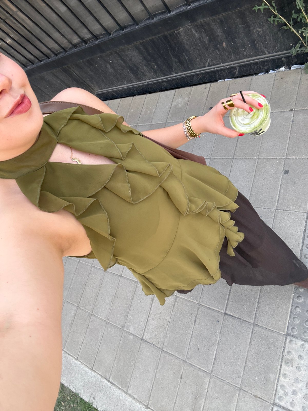 Person enjoys matcha and books during cultural space visit