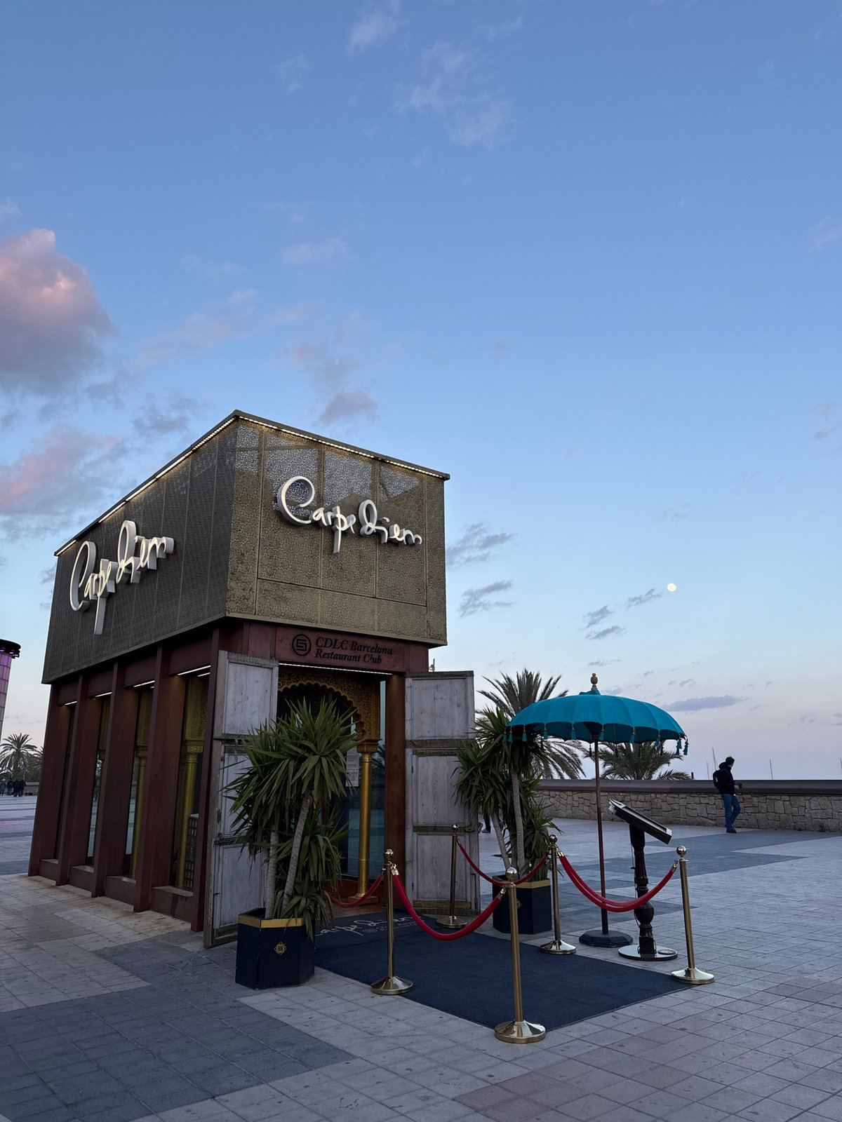 Evening scenes captured along Barcelona's palm-lined waterfront promenade