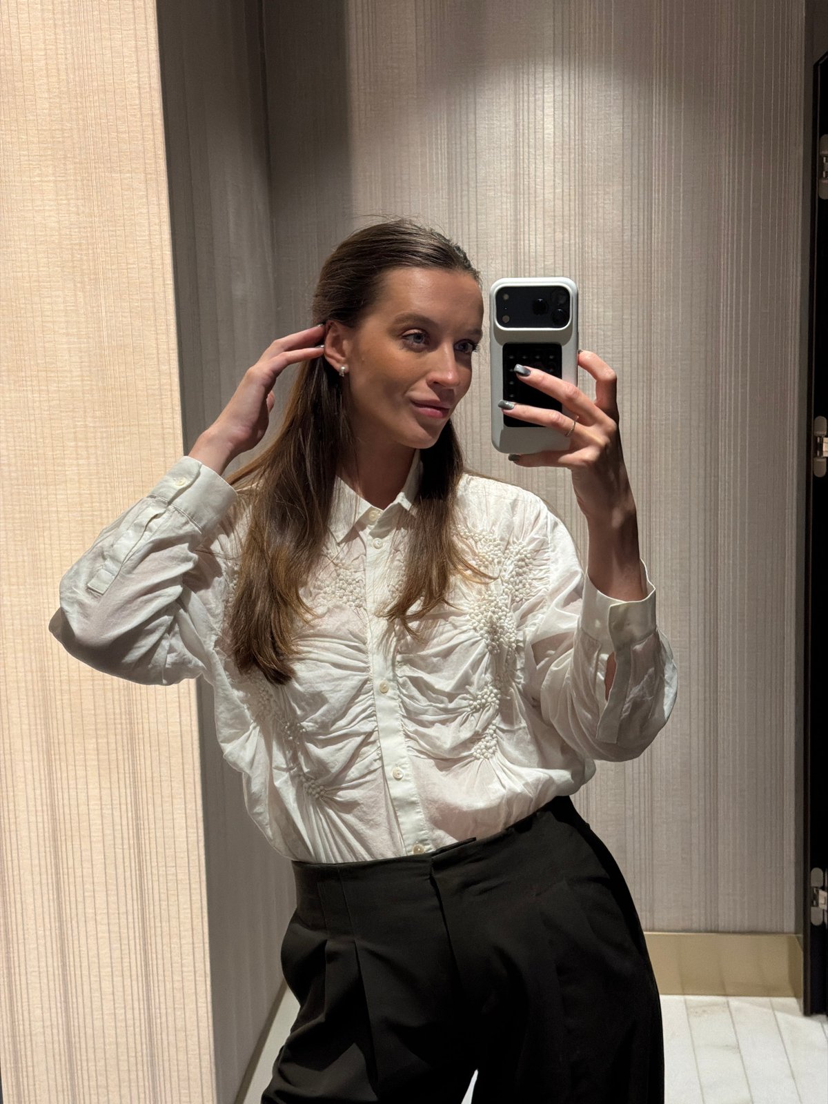 Woman takes indoor selfie in Budva, Montenegro