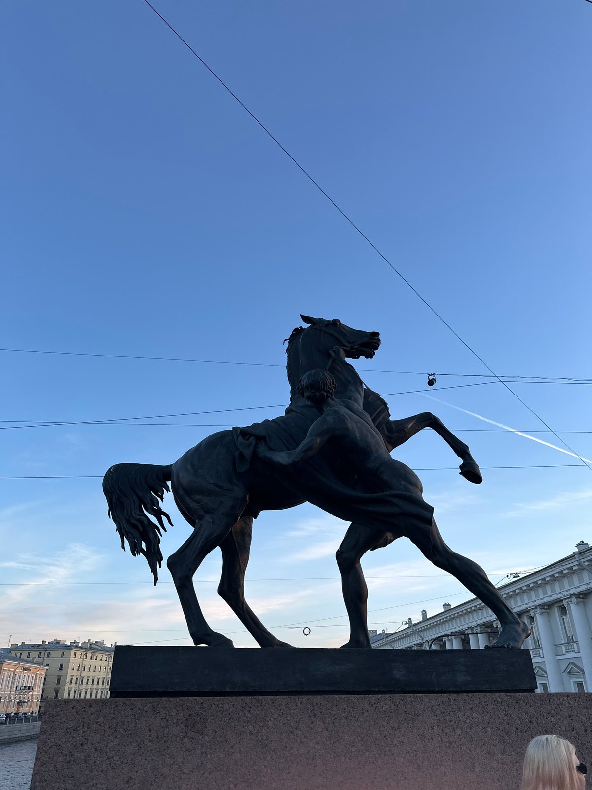 Tourist documents Saint Petersburg landmarks and streetscapes during afternoon walkabout