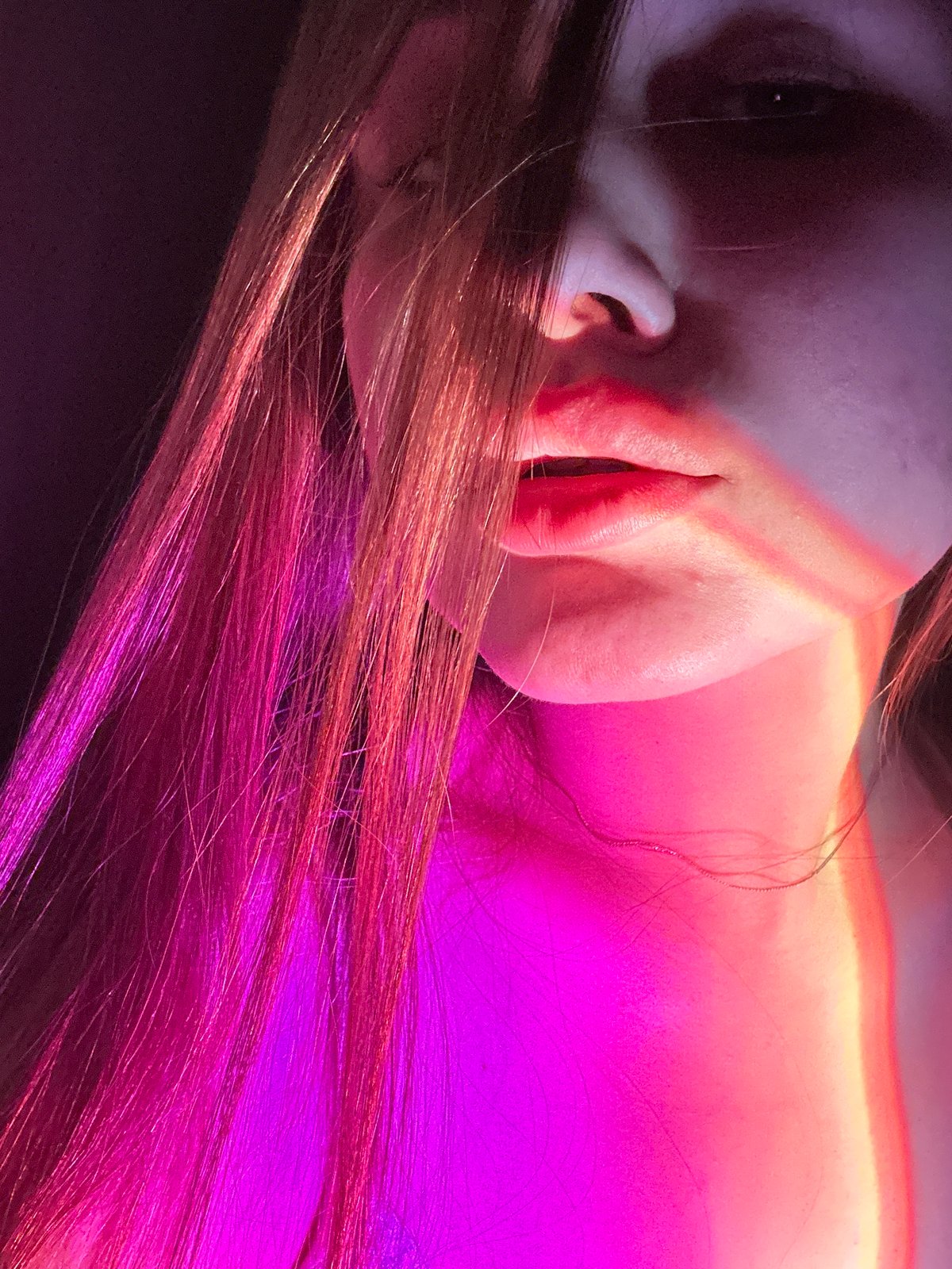 Intimate portrait session with colored lighting documented in Chaikovsky