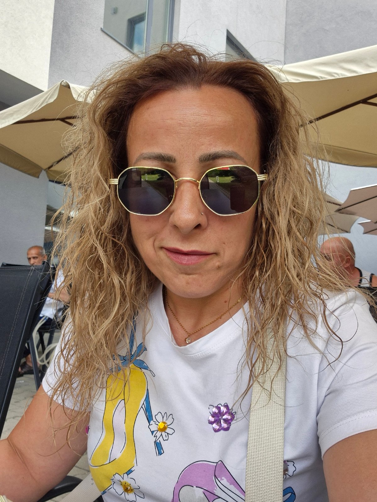 Casual daytime snapshots: selfies, an orchid, and a courtyard