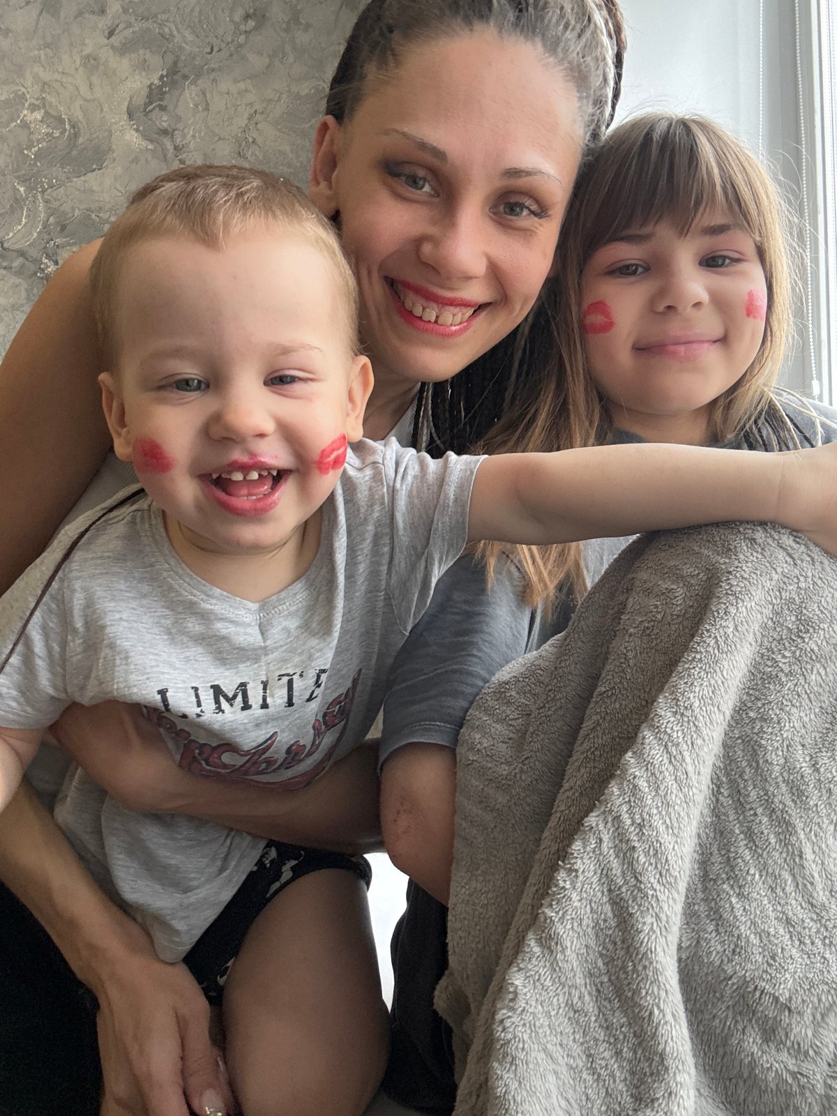 Family shares intimate moment indoors in Rusanovo, Russia