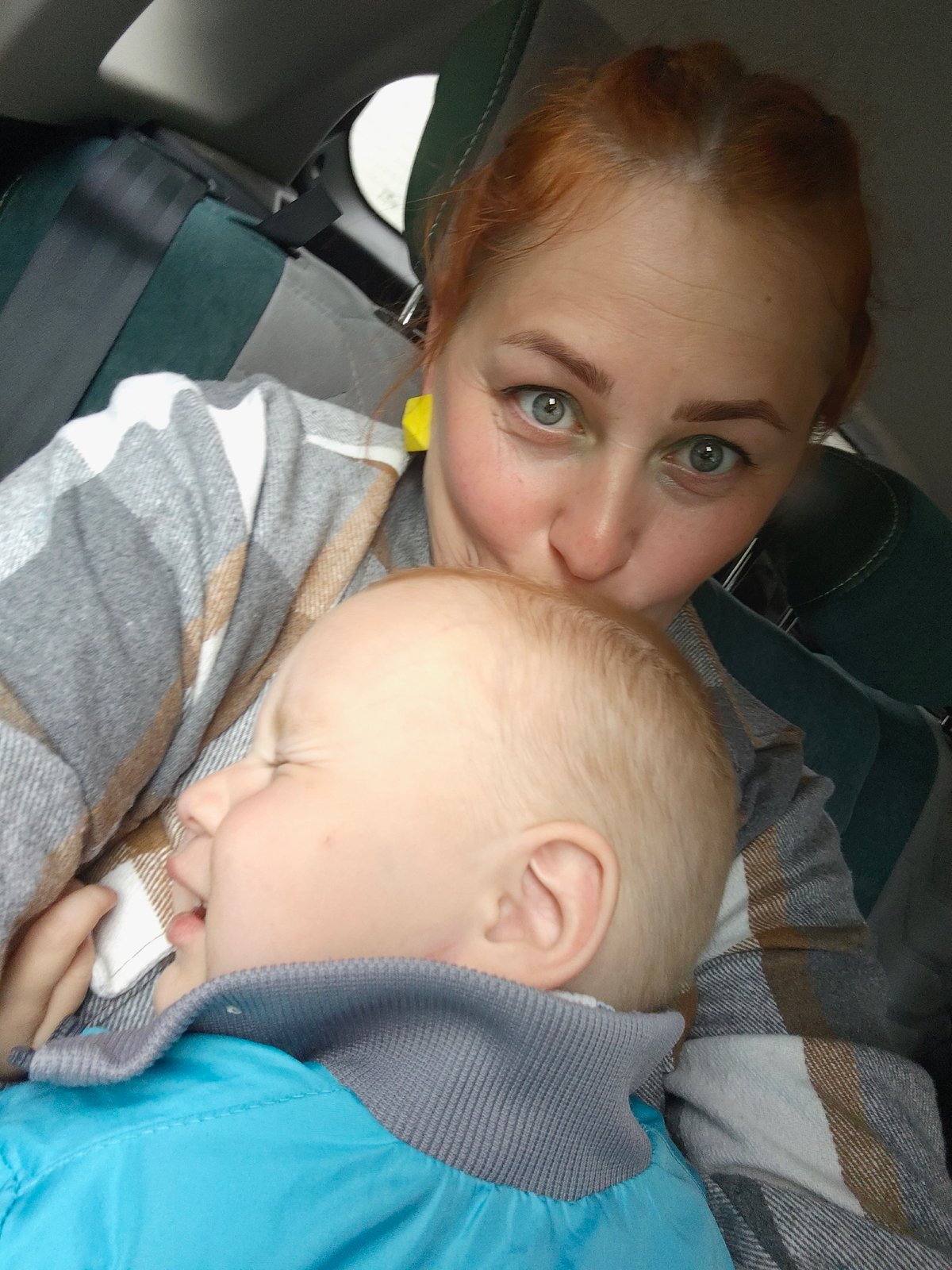 Woman and baby photographed inside vehicle in Chaikovsky, Russia