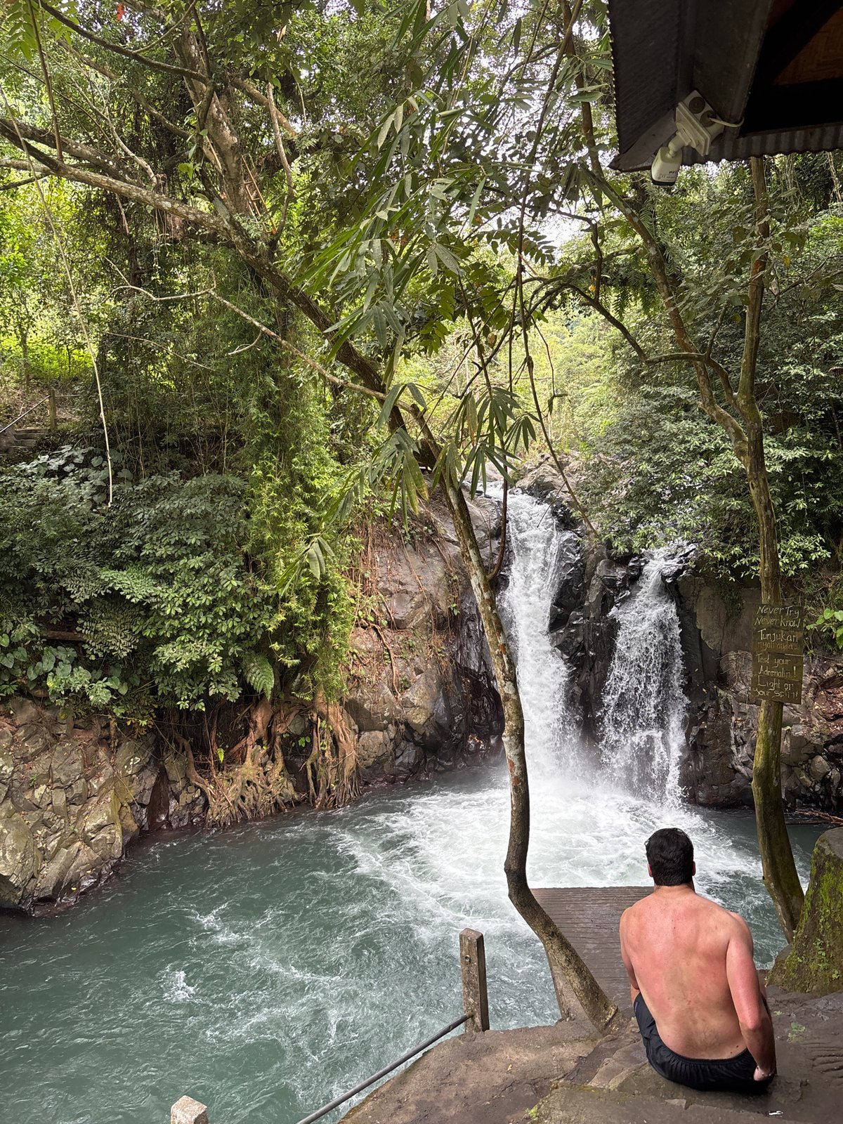Morning waterfall recreation activity captured in Sukasada Indonesia