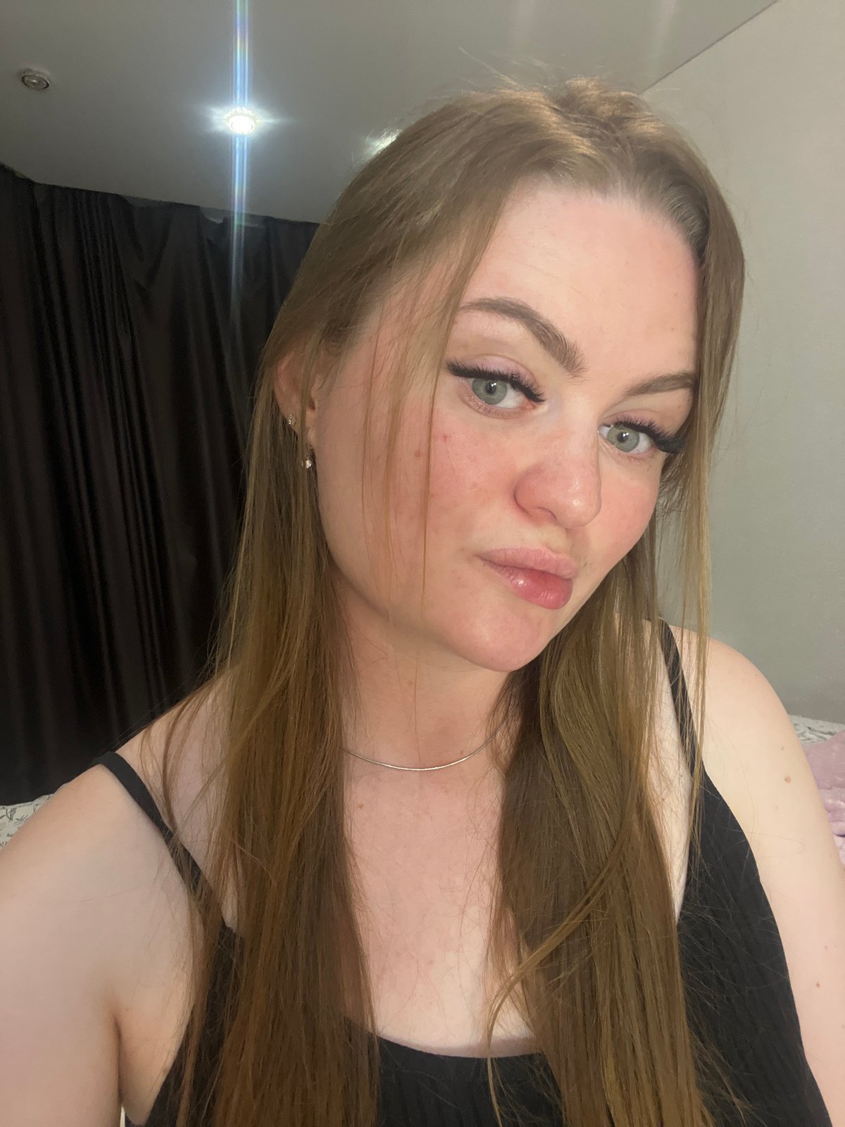 Woman documents evening selfie session in Sevastopol residence