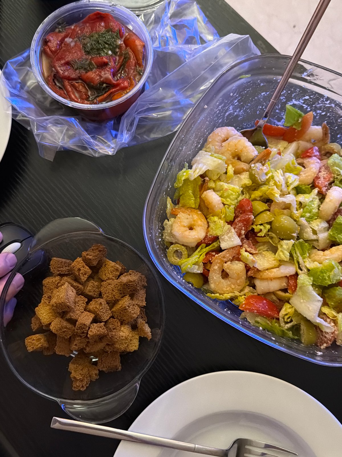Casual shrimp salad meal documented in Tel Aviv