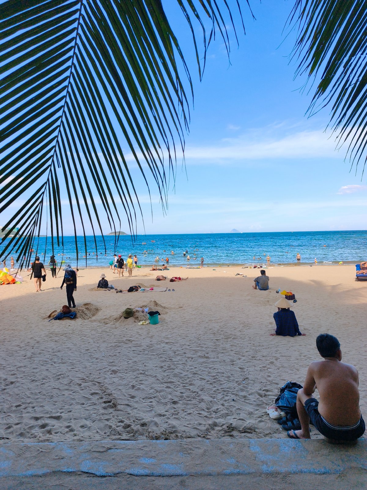 Busy beach day along Nha Trang's central coastline