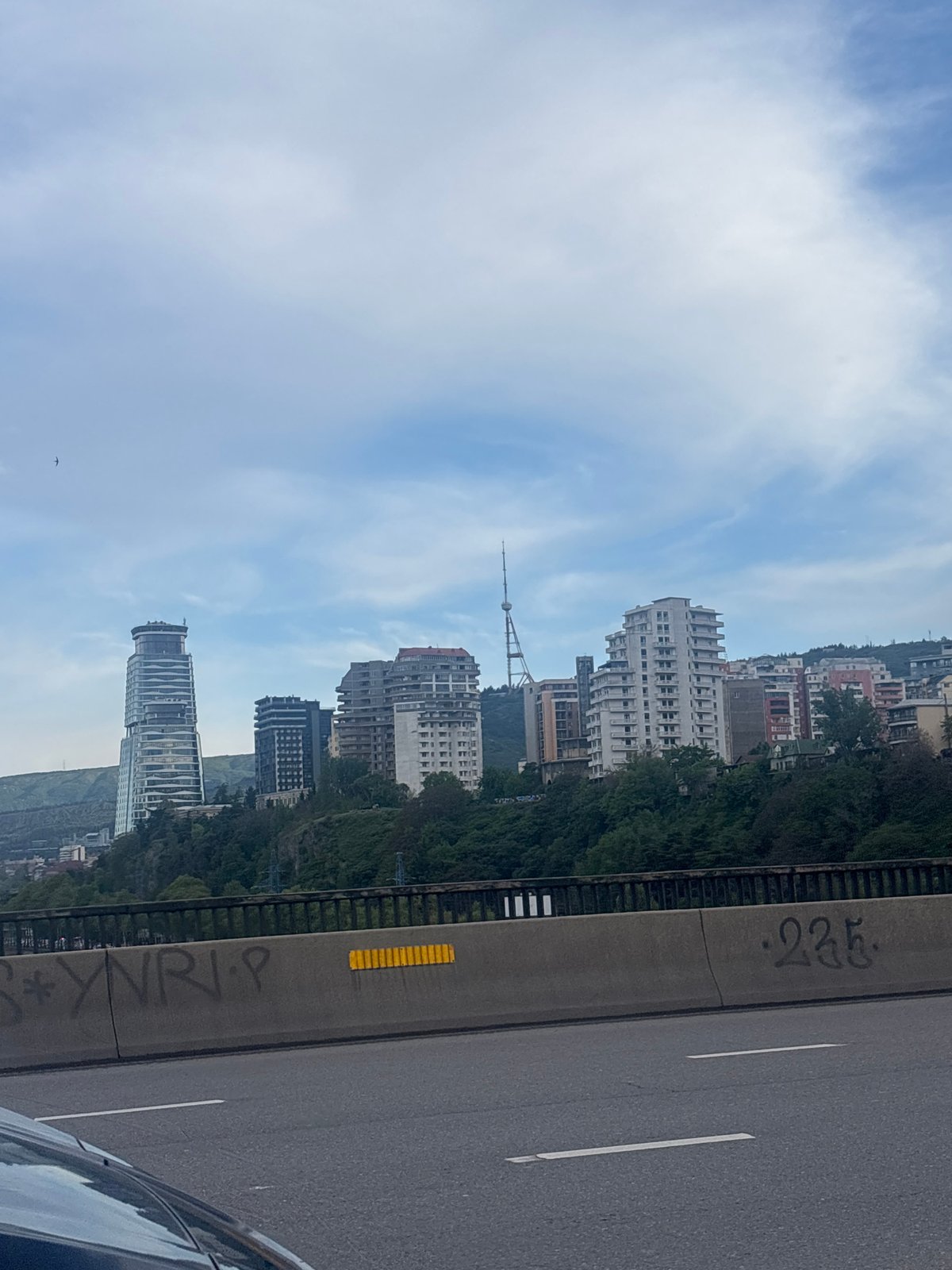 Unknown witness documents afternoon traffic, construction in Tbilisi