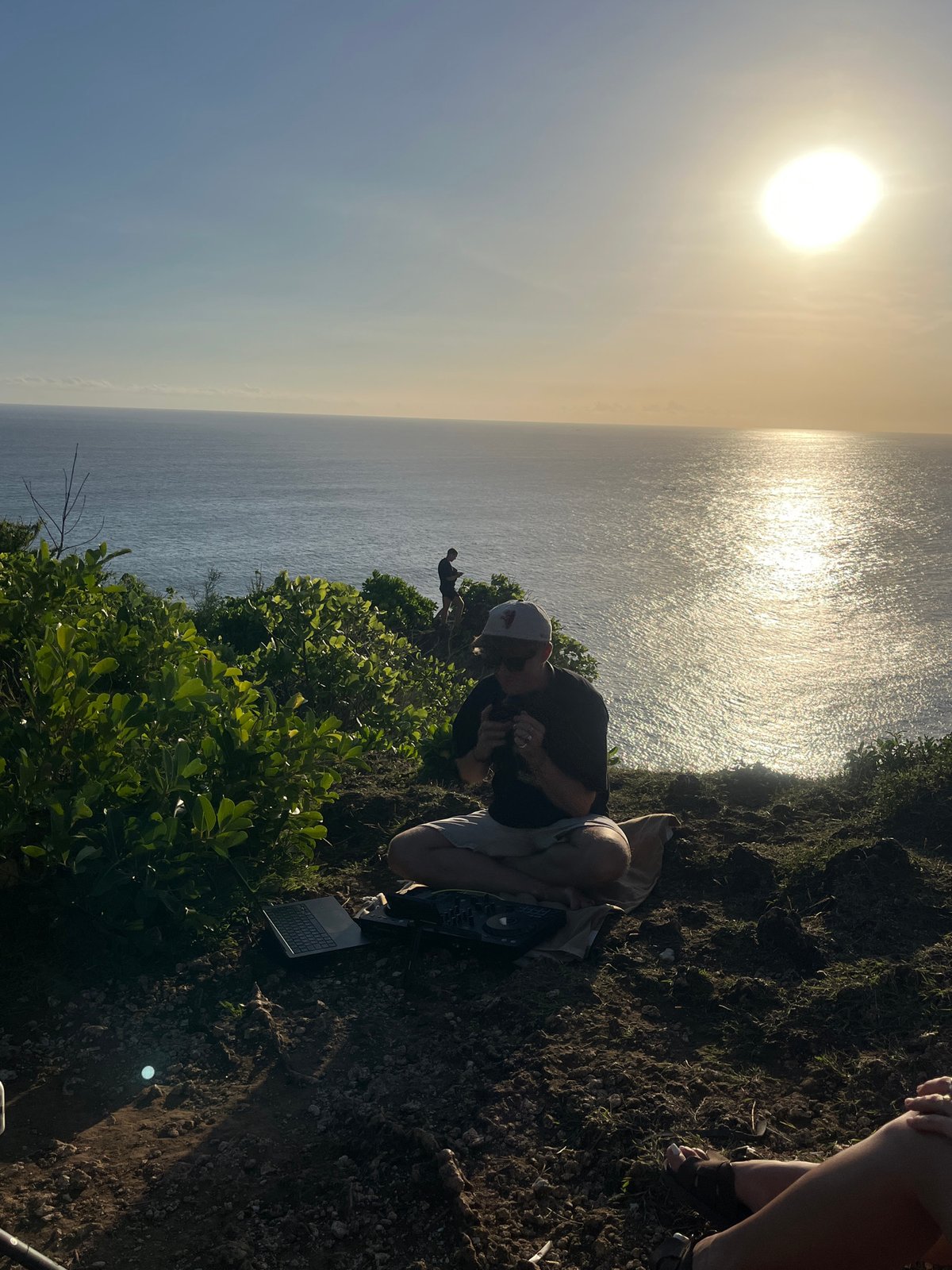 Clifftop DJ session and coastal scenes documented in Kuta Selatan