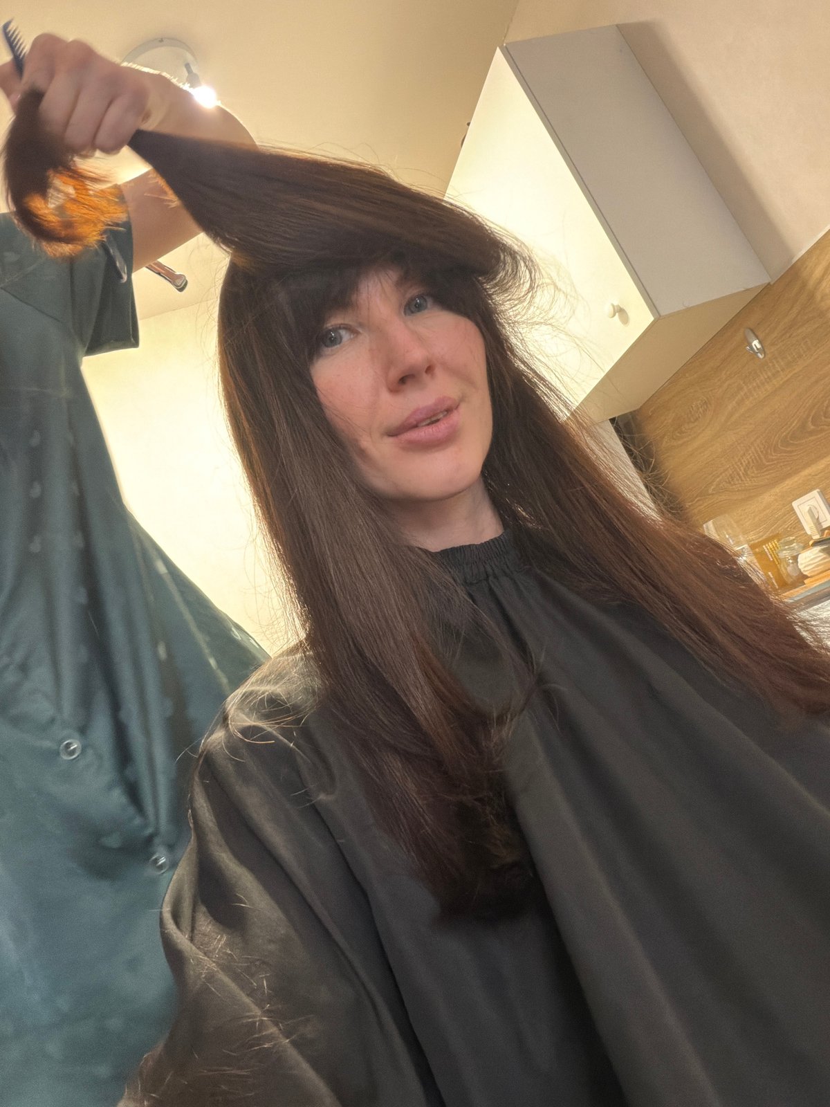 Woman prepares for haircut in Perm, Russia
