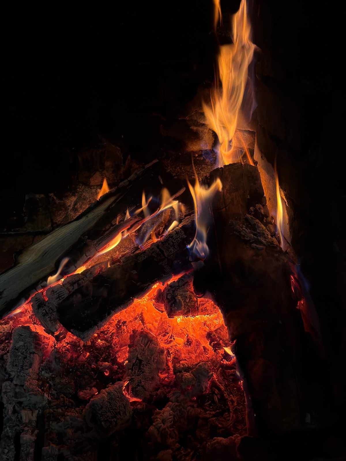 Visitor documents church, fire pit during afternoon in Lilkovo