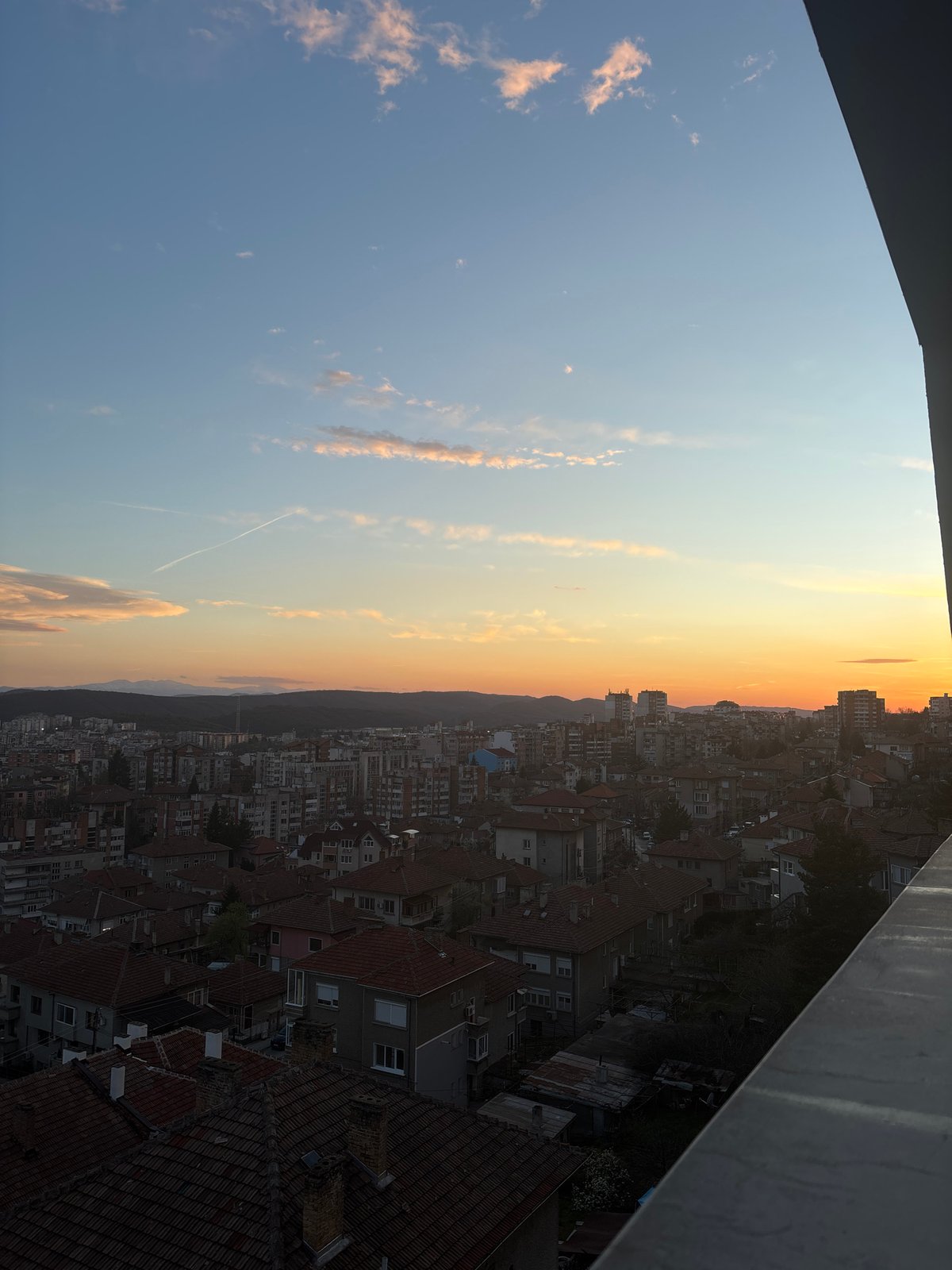 Sunset observed over red-roofed buildings in Veliko Tarnovo, Bulgaria
