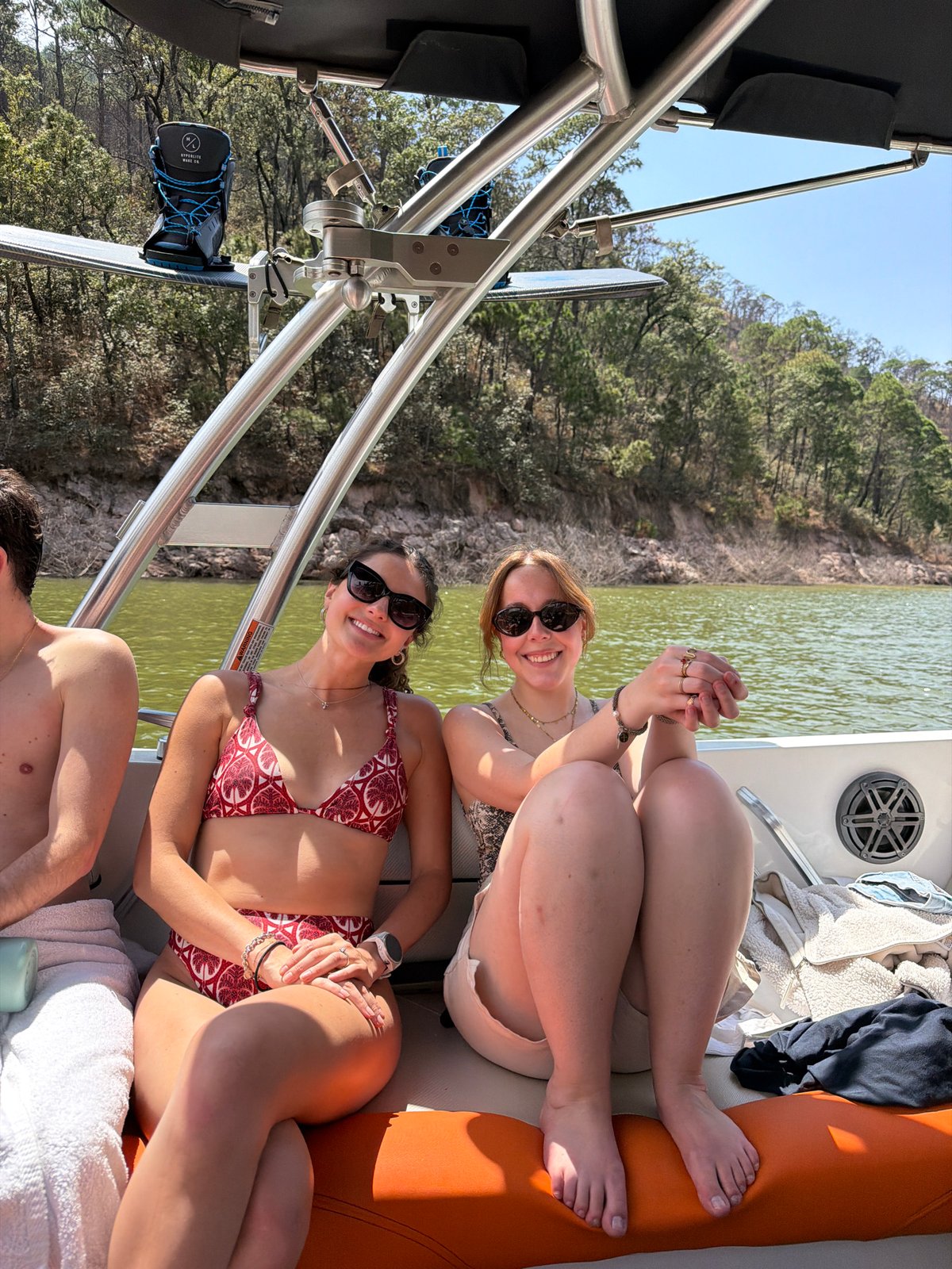 Three friends relax on boat in Valle de Bravo