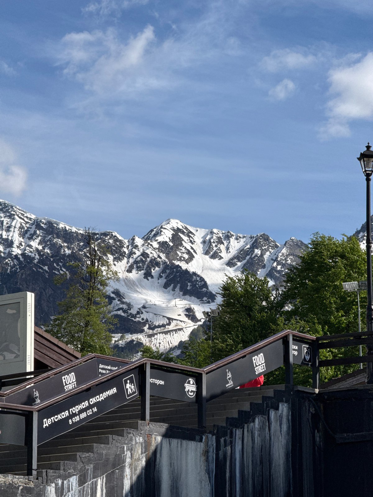 Tourist captures Olympic landmarks and mountain scenery in Estosadok resort