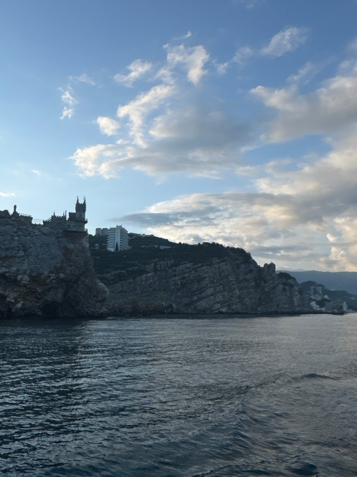 Tourists document Swallow's Nest castle amid construction activity in Gaspra