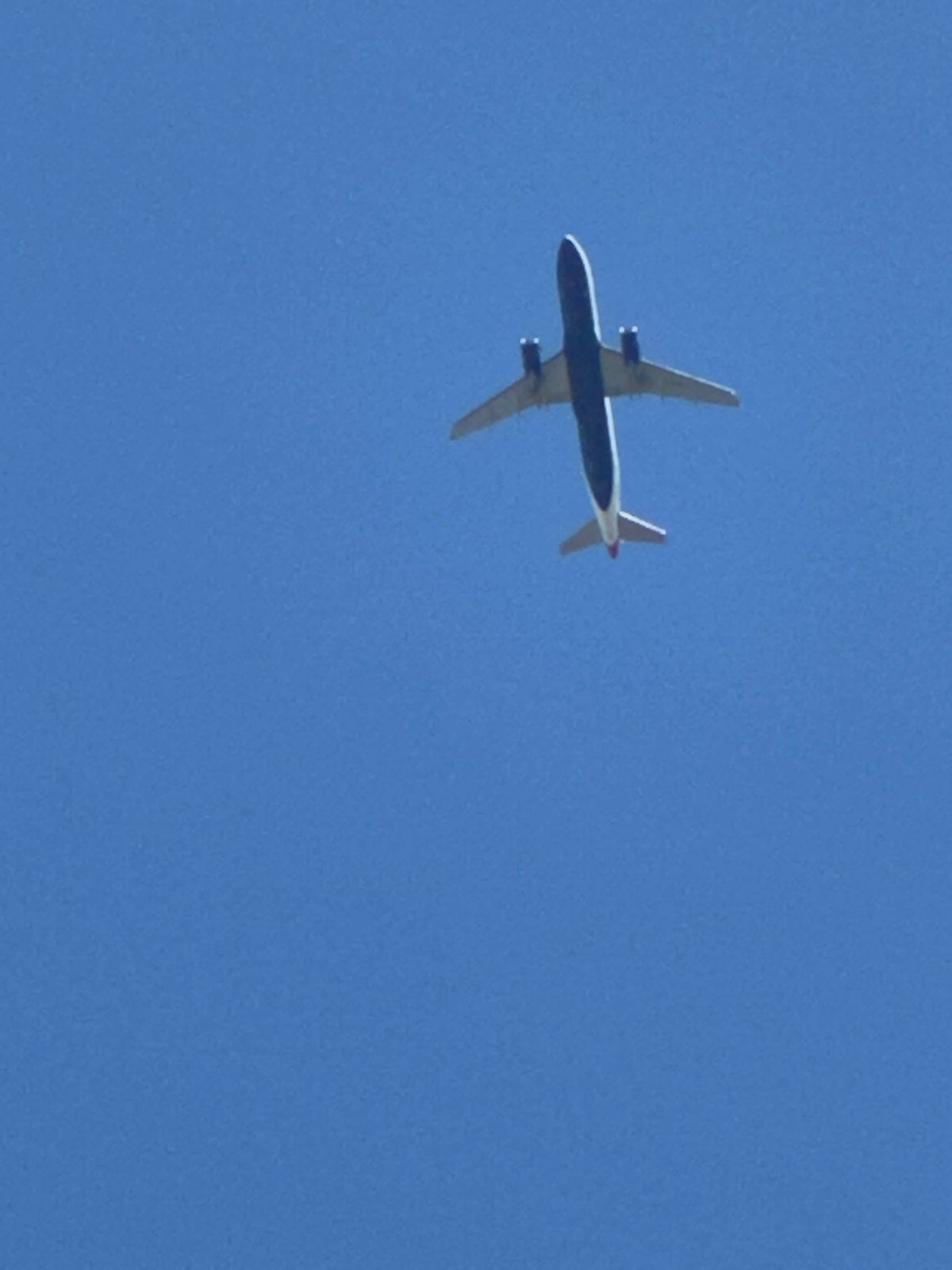 Commercial jets tracked across a clear south London sky