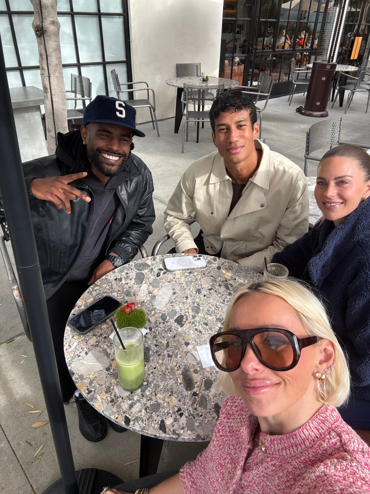 Late-night gathering of four at Los Angeles outdoor café