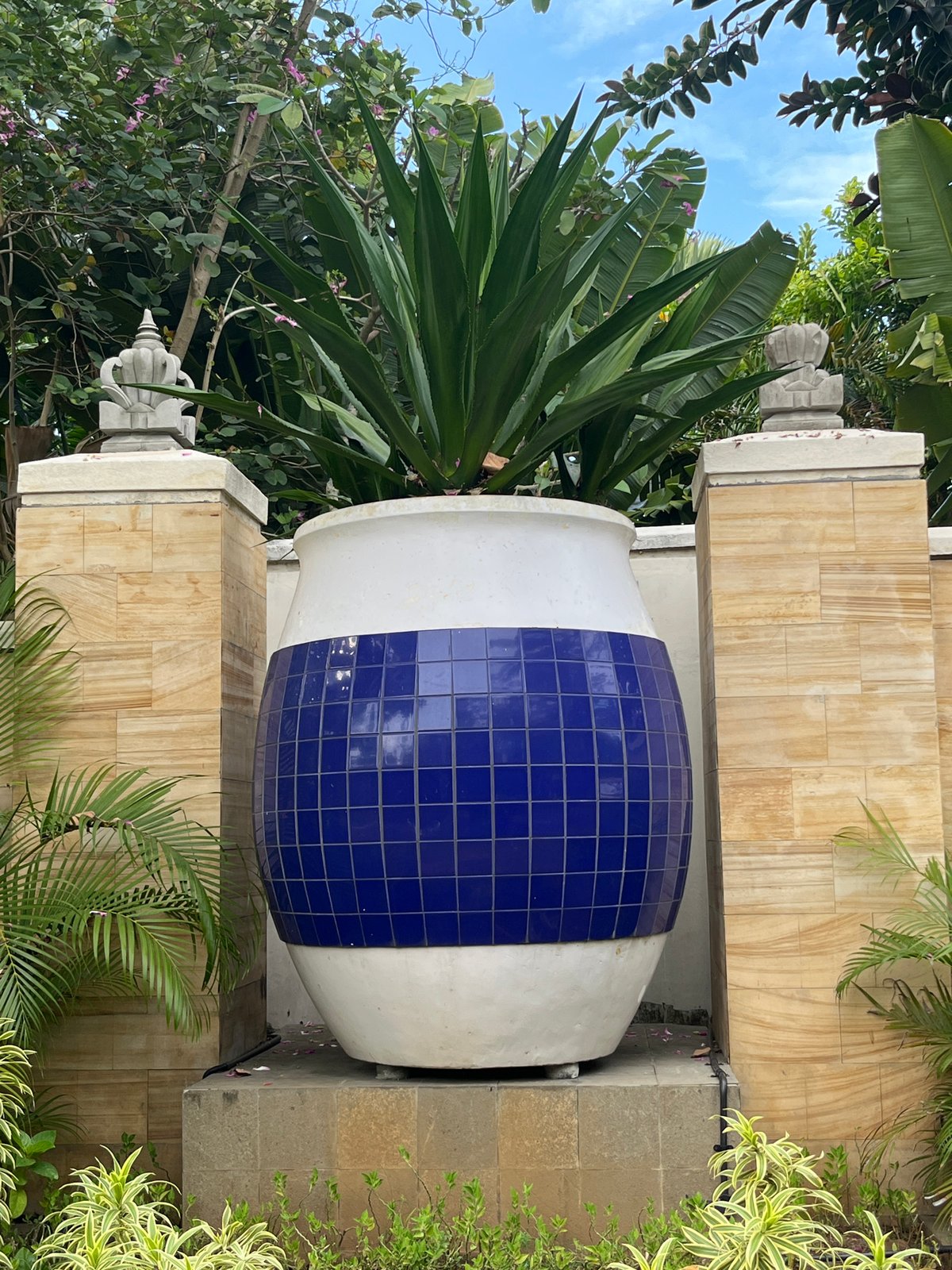 Hotel water gardens with lotus sculptures documented in Kuta Selatan