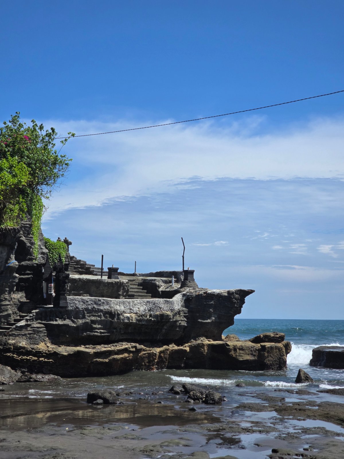 Ancient temple complex with guardian statues documented in Kediri