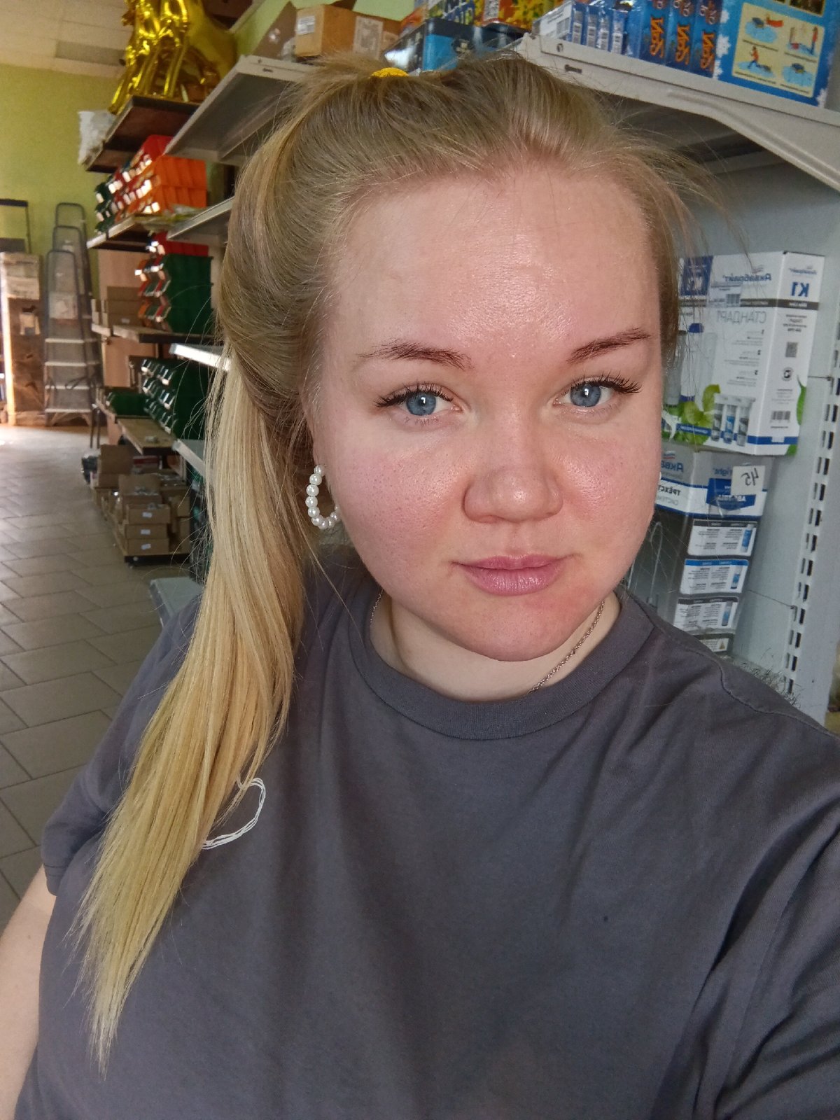 Woman takes selfies in Russian shop during morning hours