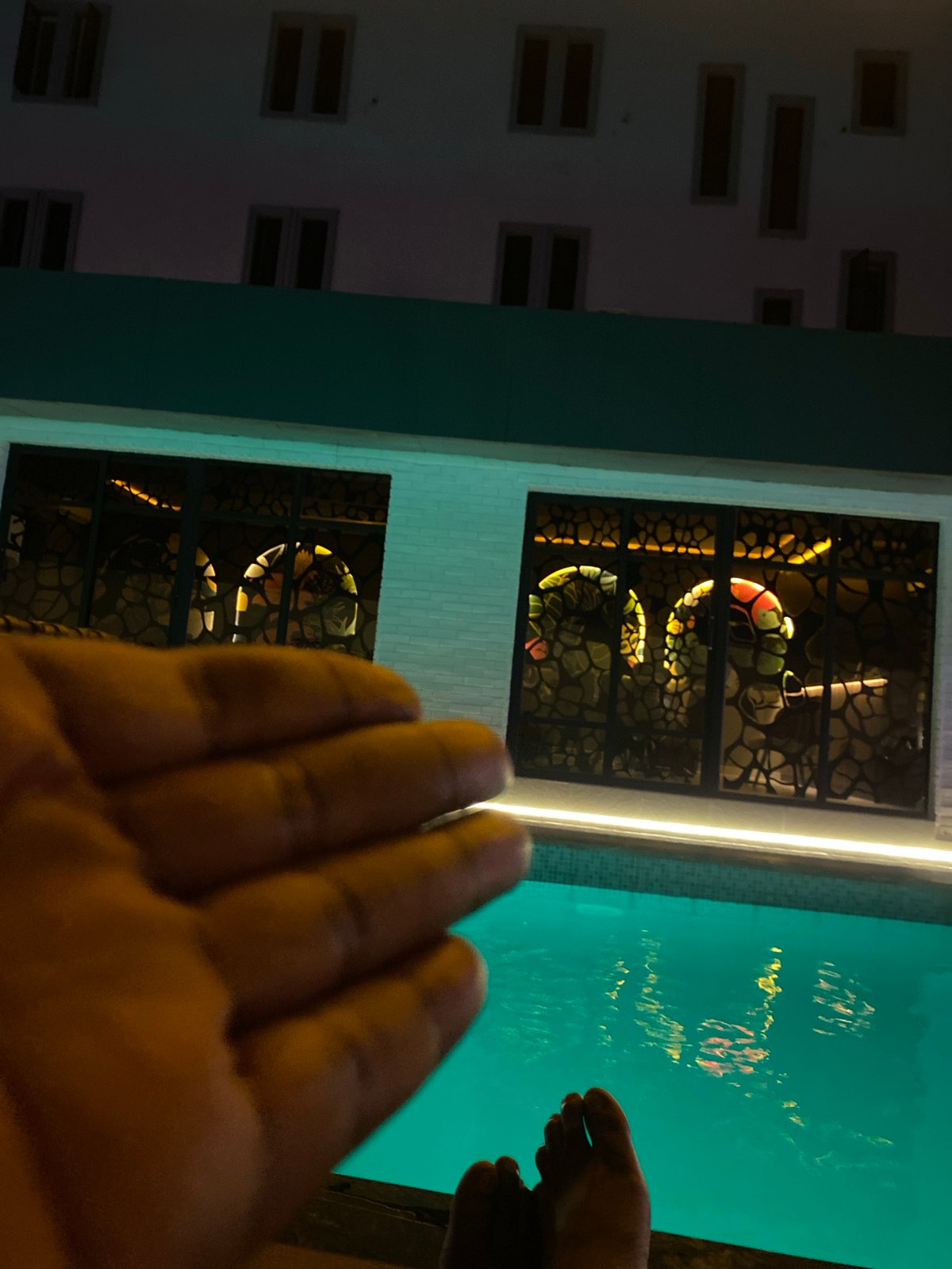 Evening poolside gathering documented in Kubwa, Nigeria
