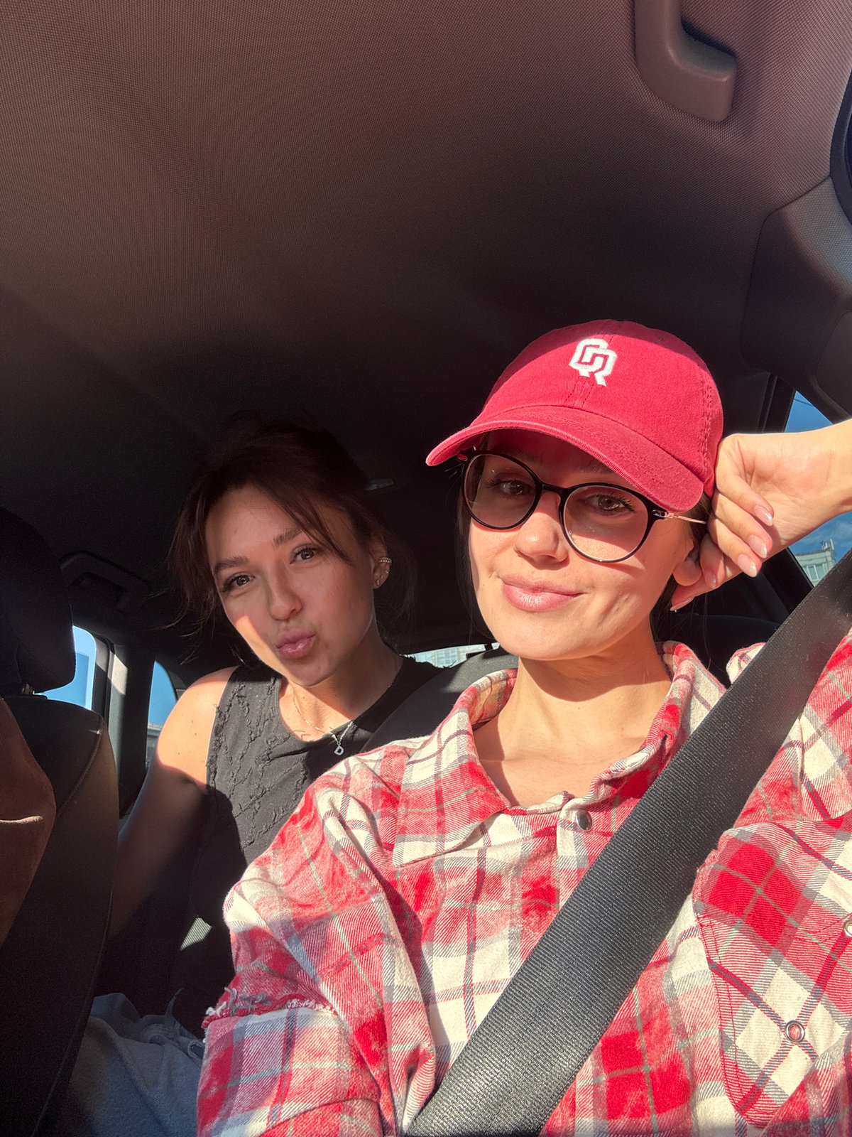 Three people photographed together in car in Krasnoyarsk