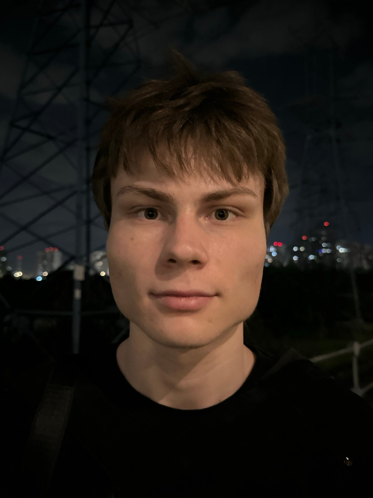 Portrait captured against Moscow nighttime skyline backdrop