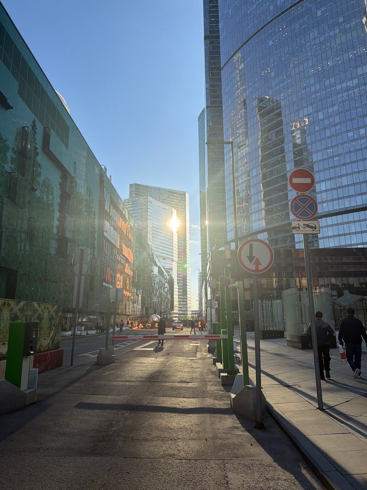 Modern glass buildings and street signs observed in Khimki