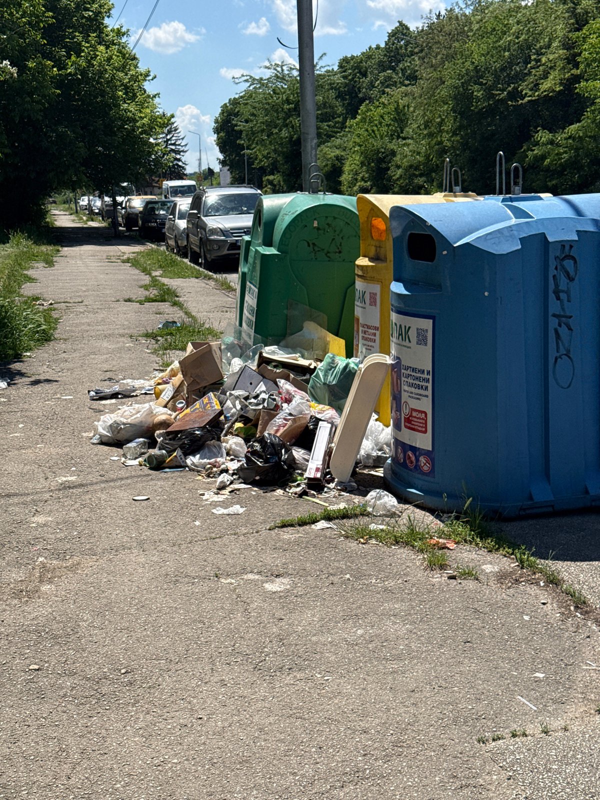 Overflowing trash documented beside recycling bins in Lovech, Bulgaria