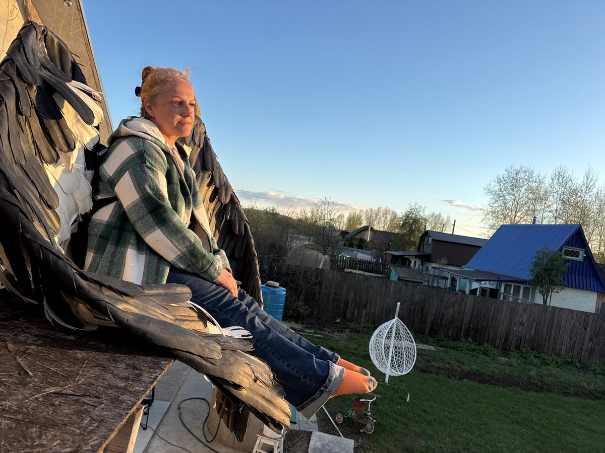Casual backyard activities documented in Chaikovsky, Russia during afternoon