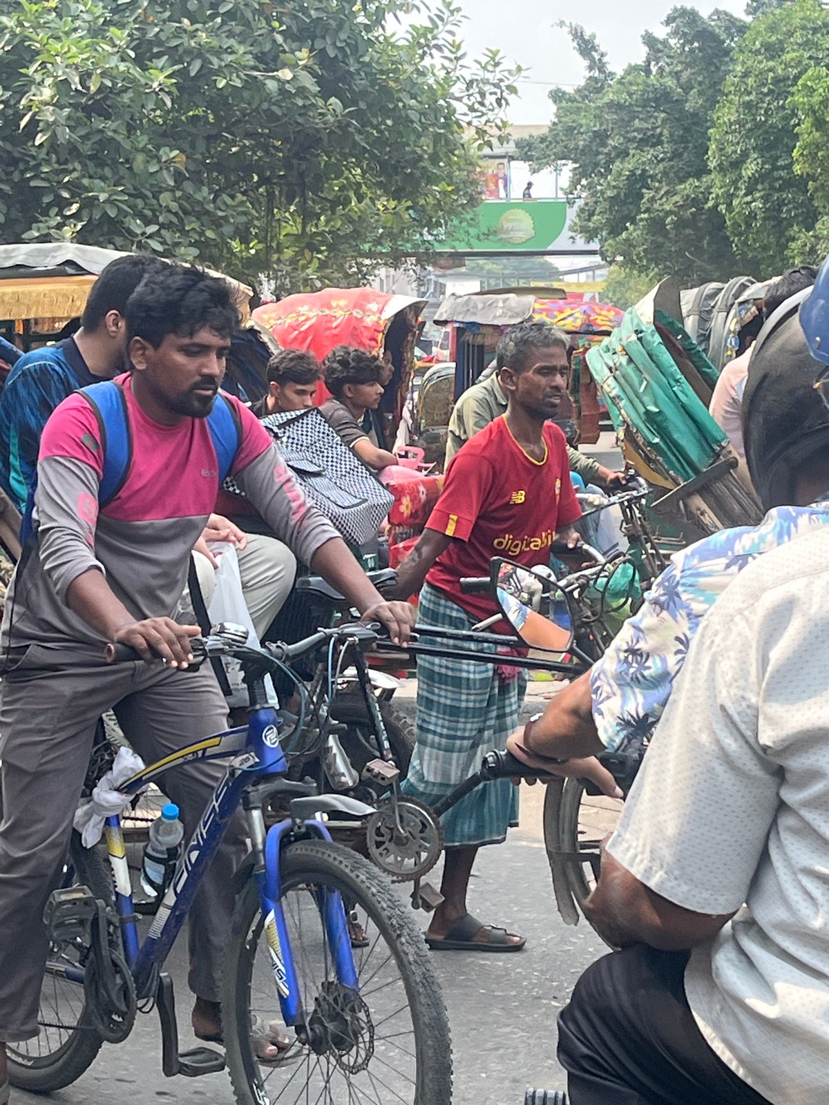 Morning street life documented in Dhaka transportation hub