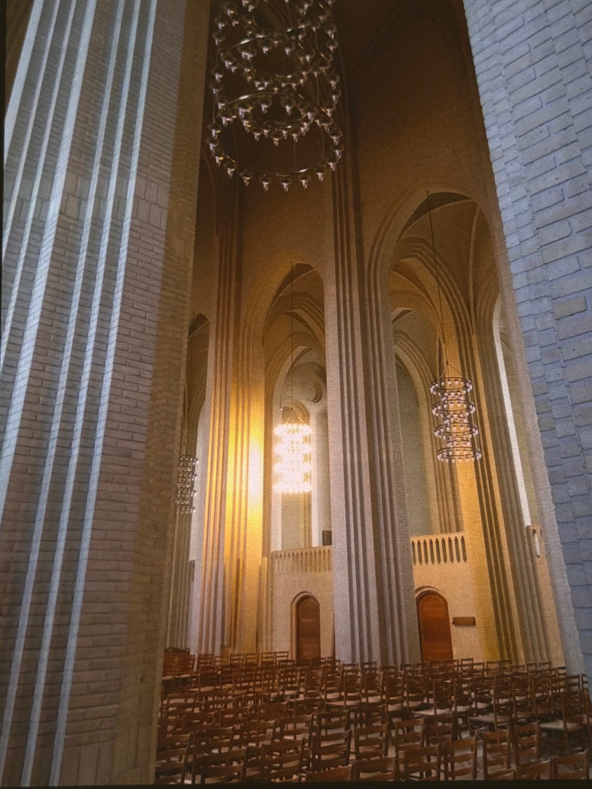 Inside Dresden's Frauenkirche, with chandeliers, columns, and oysters