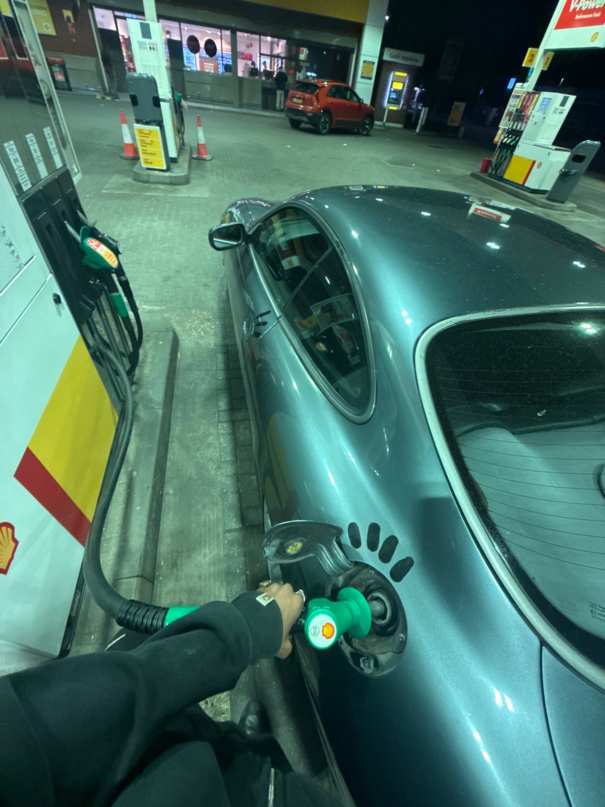 Grey car refueled at London Shell station Tuesday night